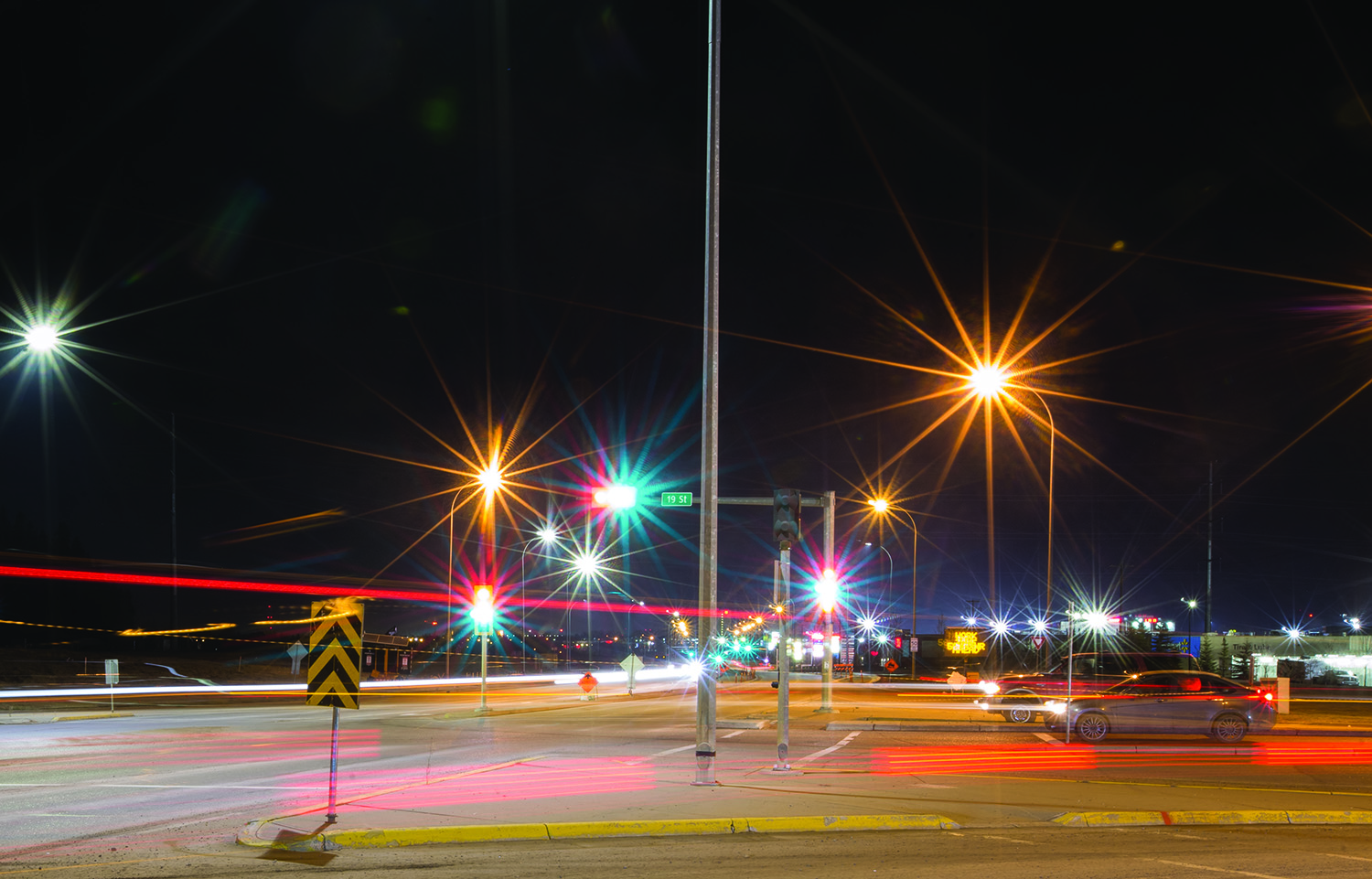 NIGHT LIGHTS- Red Deerians made their way through the intersection of Taylor Drive and 19th St in Red Deer as they went about their business on Sunday evening. The intersection has seen increased traffic flow since the closure of the South Gaetz interchange. Zachary Cormier/Red Deer Express