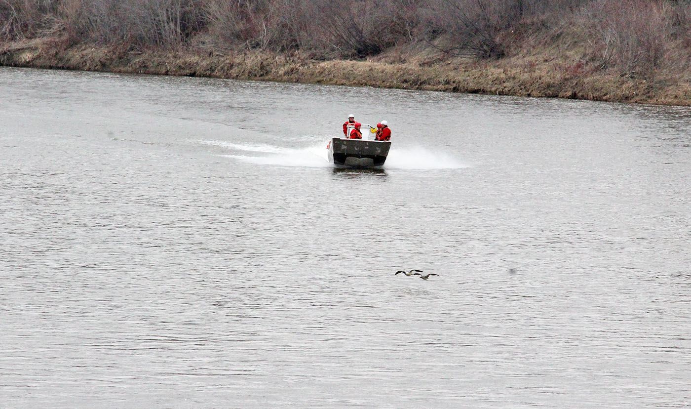 SEARCH AND RESCUE - A Search and Rescue crew looks for a man who reportedly jumped off the 67th Ave. bridge Monday afternoon. The man was found