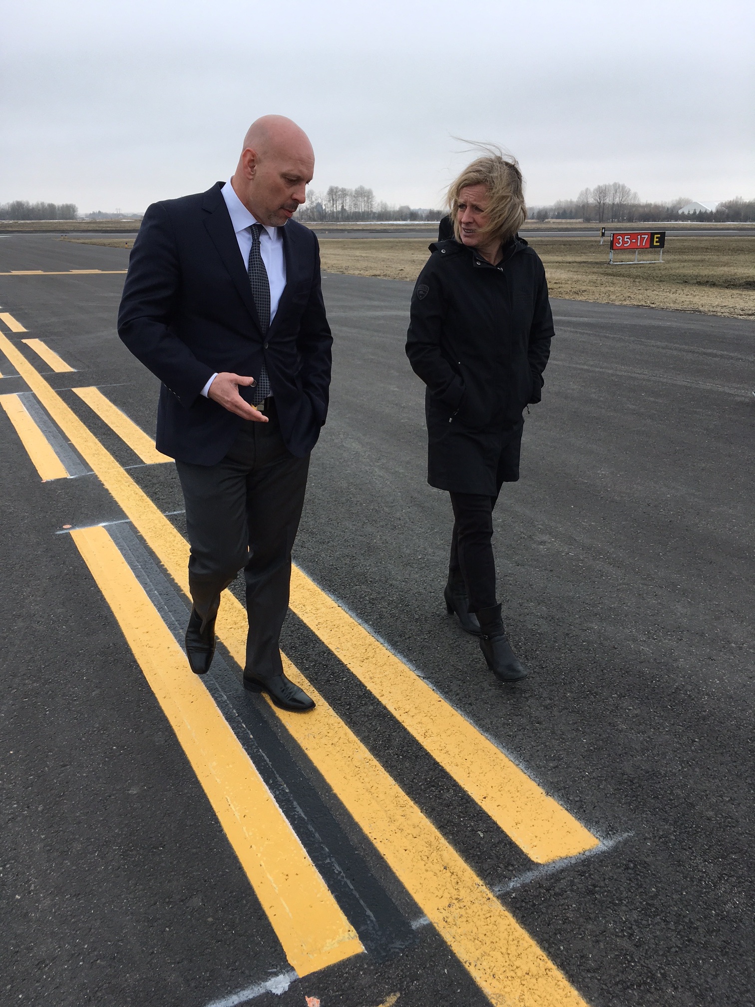 ON TOUR - Red Deer Airport CEO Graham Ingham and Alberta Premier Rachel Notley took a walk on the new runway extension on Thursday. A grand opening of the extension will take place May 12th.
