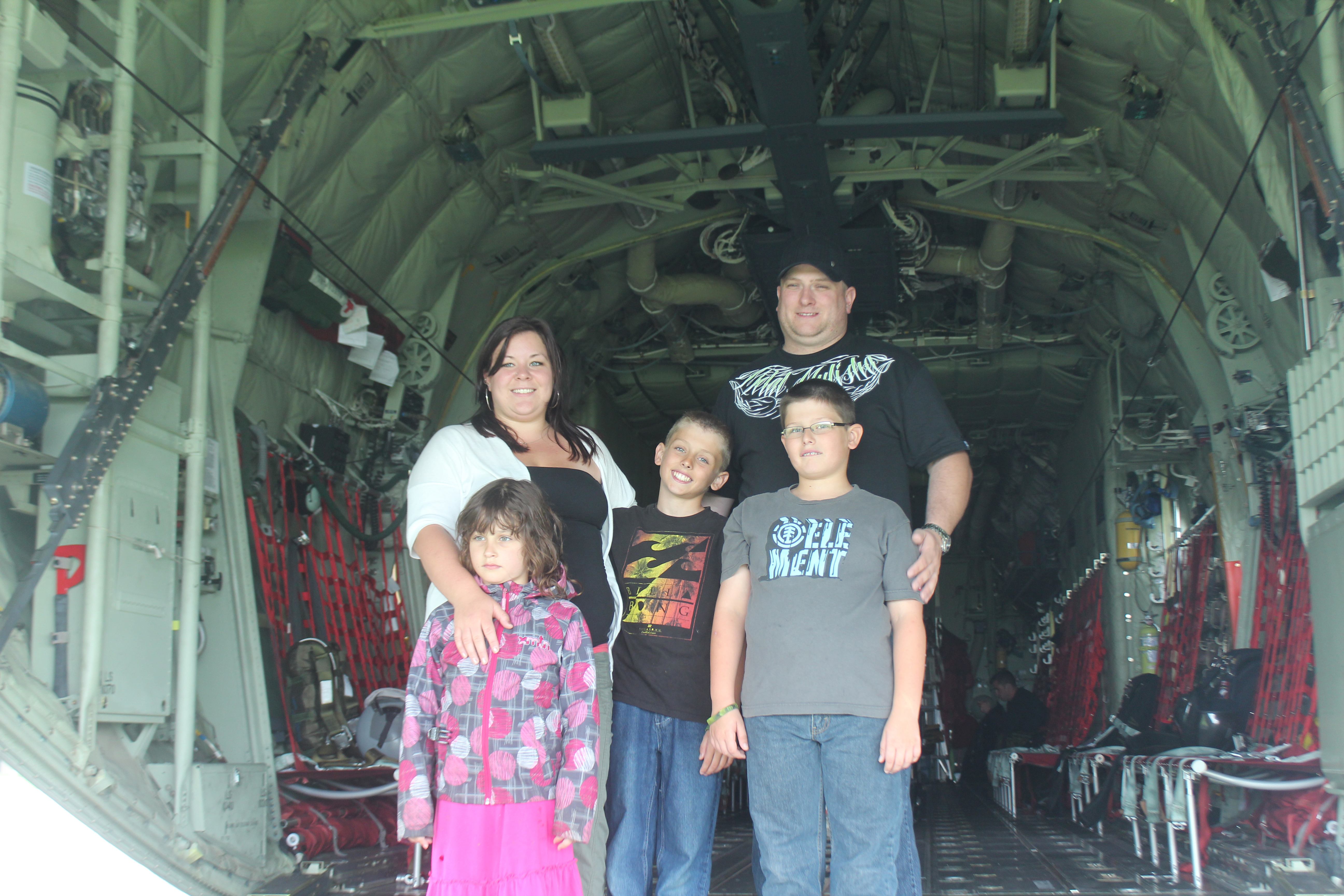 EXCITED VISITORS - Mariana Chatron and Malcolm Davis wait with their three children