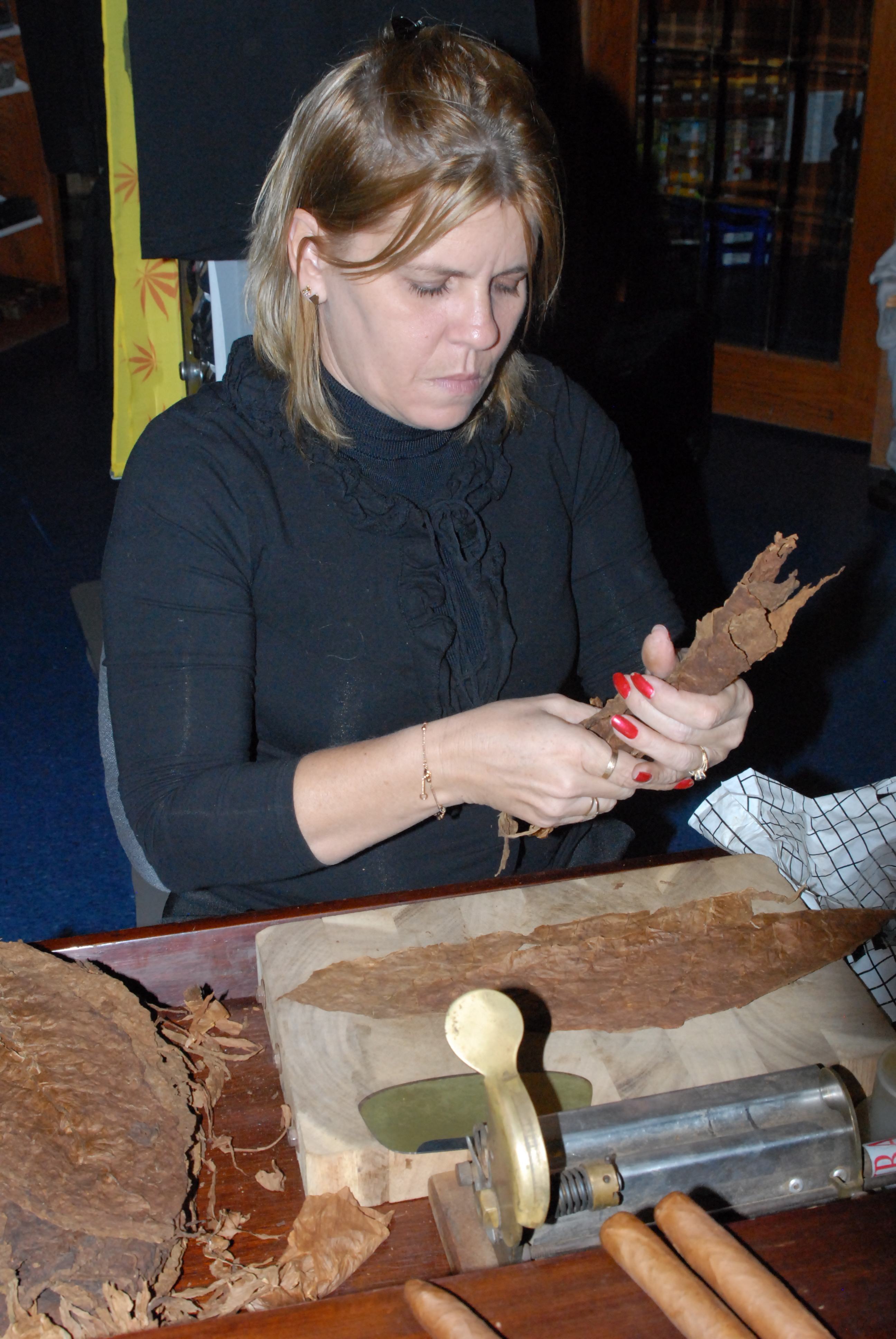 FINE ART- Miltania Perez demonstrated how to roll a Cuban cigar at Gord’s Smoke Shop in Red Deer recently.