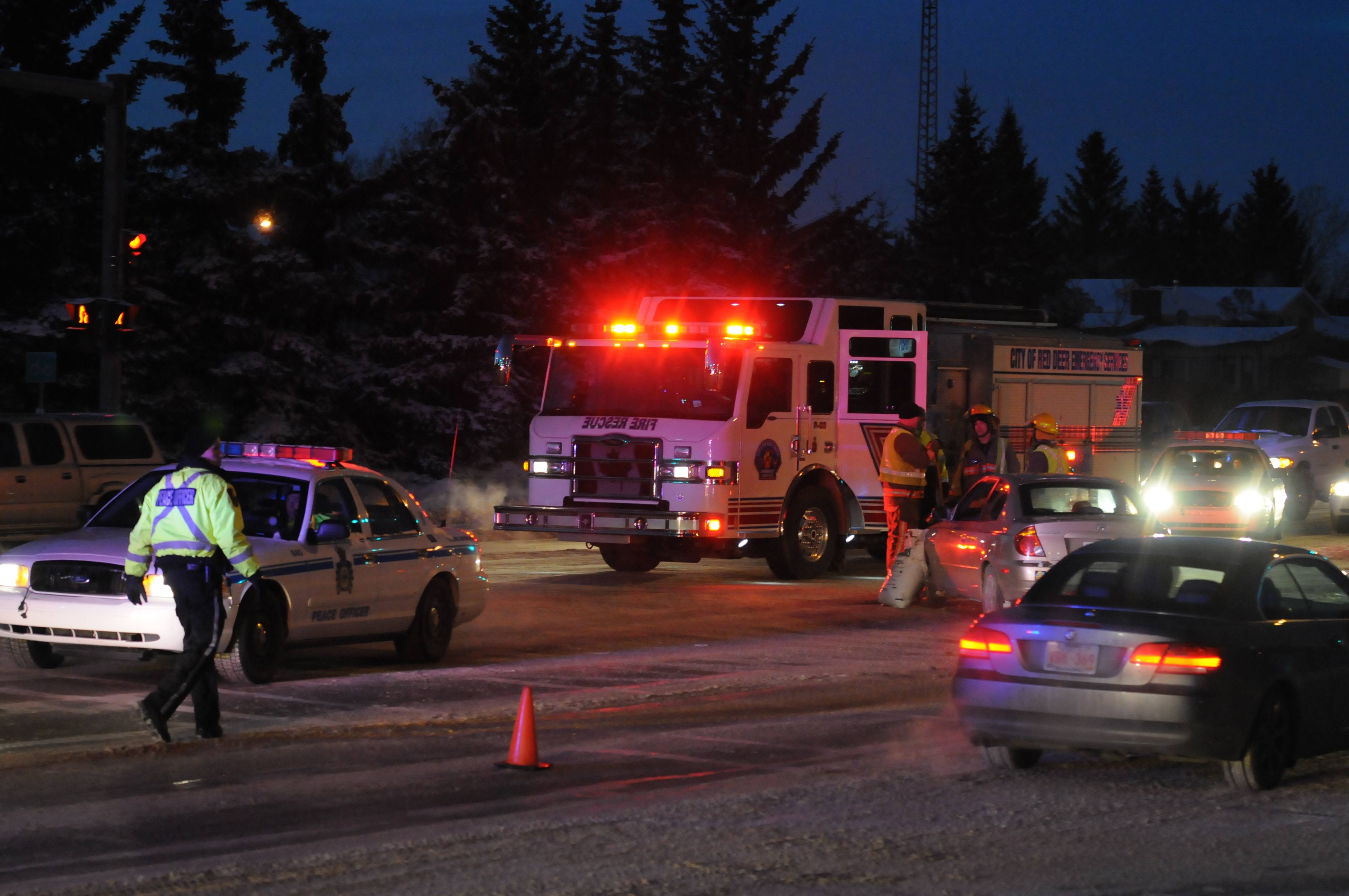 SLIPPERY- Red Deer Emergency Service Crews investigate a crash Wednesday afternoon at the intersection of Taylor Dr. and Horn St. at around 5 p.m. which sent one person to hospital with minor injuries. With temperatures at a record low ice around intersections has been the main cause of most accidents in the City.