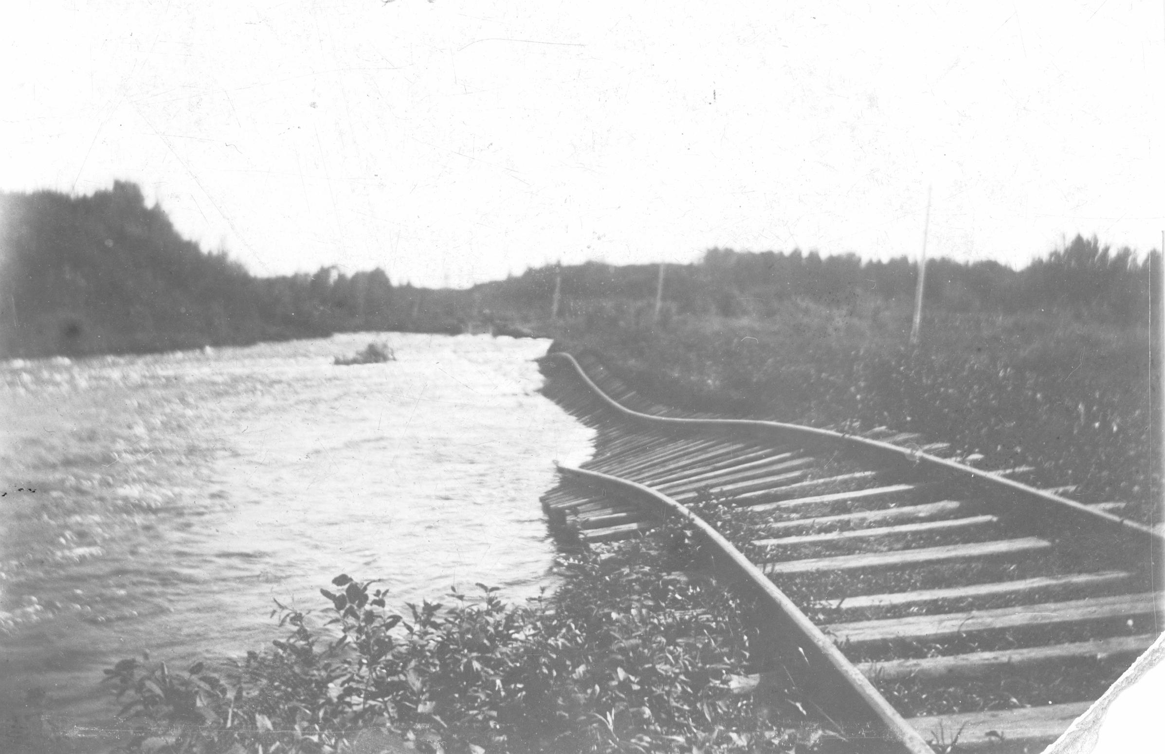 HEAVY RAIN- Main C.P.R. line washed out by Waskasoo Creek south of 43rd St. (near the current location of the Vat) Red Deer