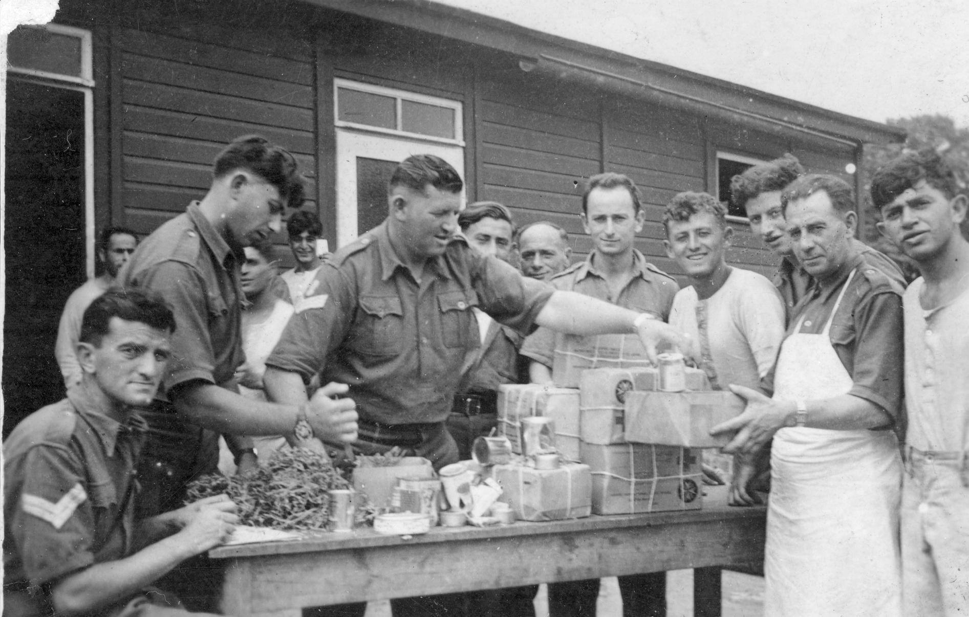 REMINDERS OF HOME- Distribution of Red Cross parcels at Stalag VIII B near Lamsdorf