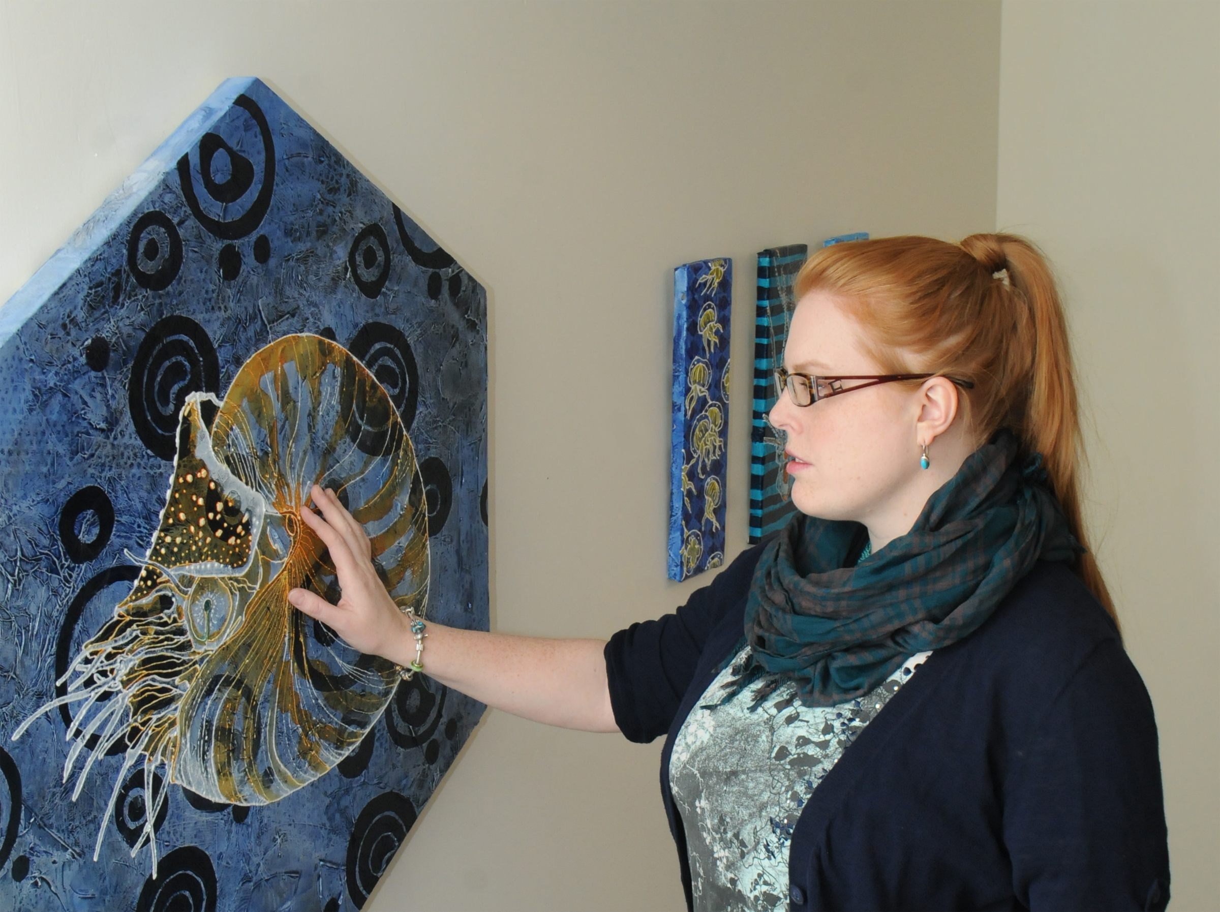 OWN CREATION- Local artist Erika Schulz feels one of her paintings in her exhibit called ‘Of Patterns and Sea Creatures’ which will be on display until Jan. 29 at Gallery IS in Red Deer.