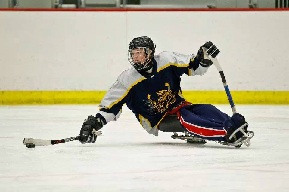 NEVER GIVE UP – Tanner Fandrey has overcome his physical limitations through sledge hockey and has excelled at the sport. He hopes to compete in the 2018 Winter Olympics in Korea.