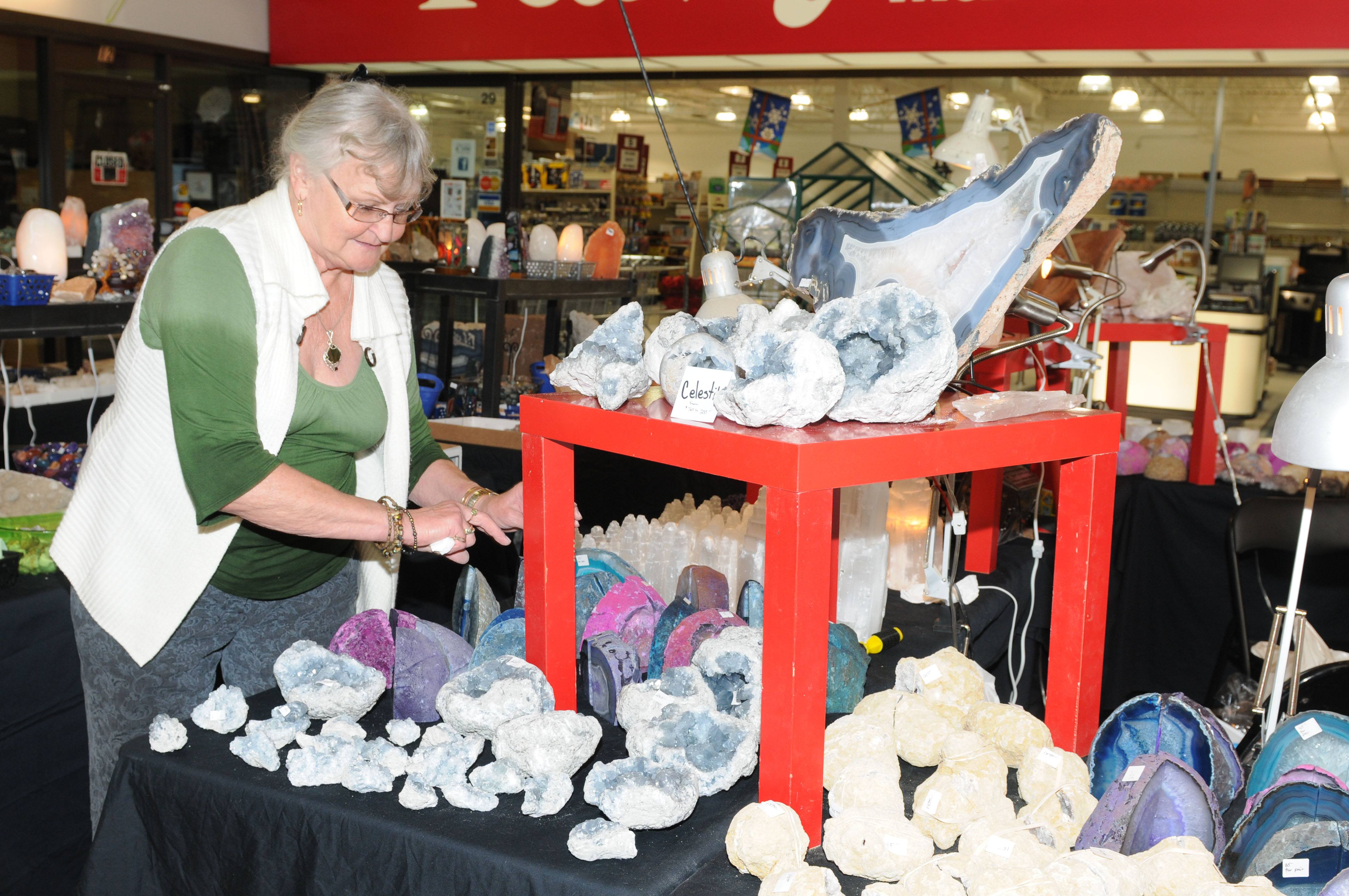 GEMS- Kit Glimm sorts some of the many rocks and minerals during Silver Coves show at the Lacombe Mall recently.