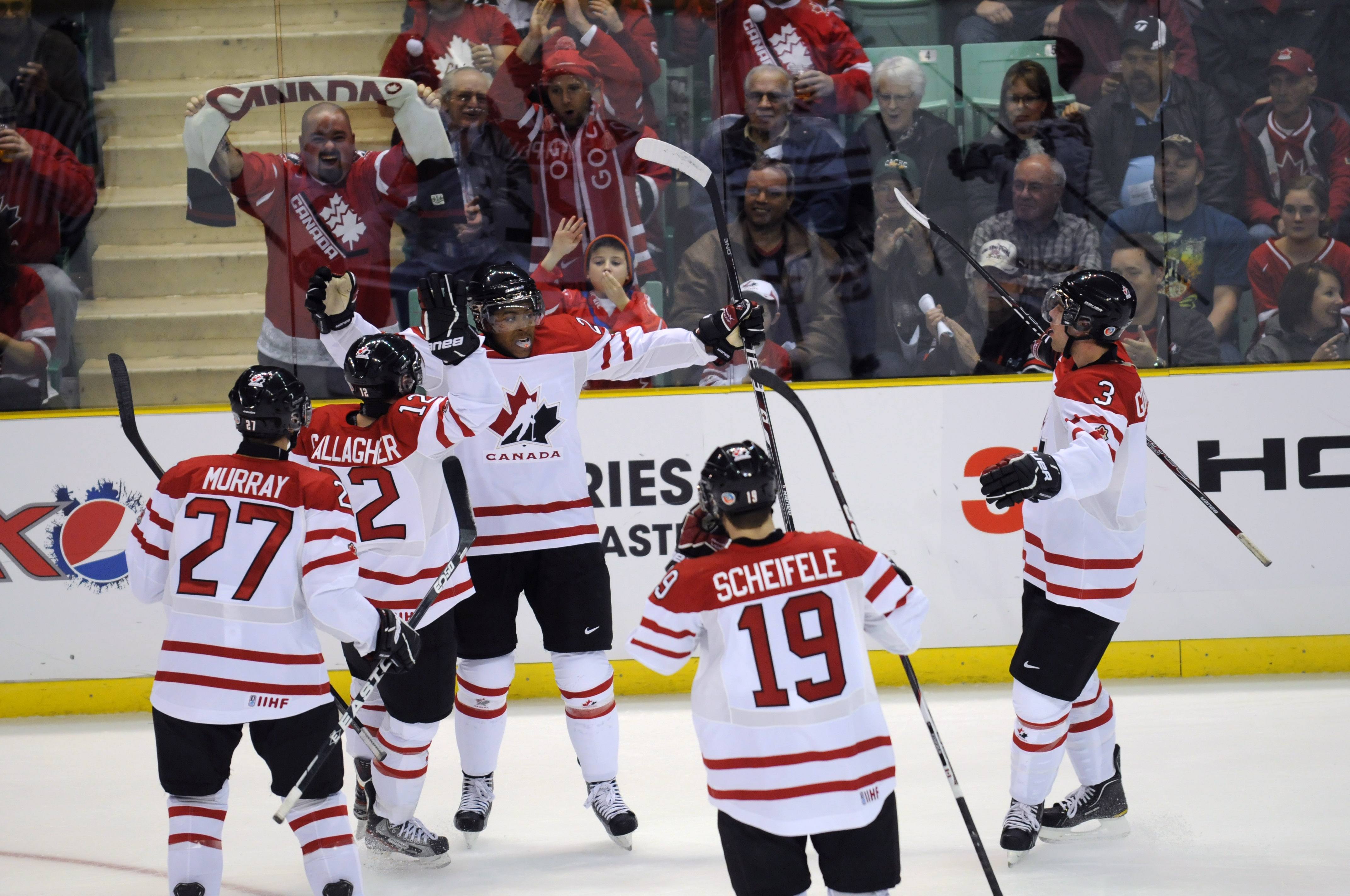 GOAL- Team Canada celebrated their first goal Thursday night during the pre-competition game of the 2012 World Junior Championship tournament at the Centrium. Canada won 7-1 Thursday night but lost 5-3 against Switzerland.