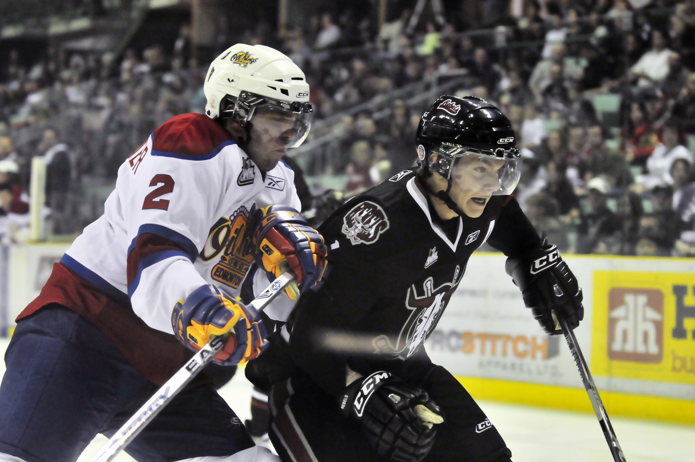 IMPACT-Red Deer Rebel Byron Froese and Edmonton Oil King Adrian Van de Mosselaer brace for impact during the Rebels home opener Saturday night. The Rebels won 8-1.