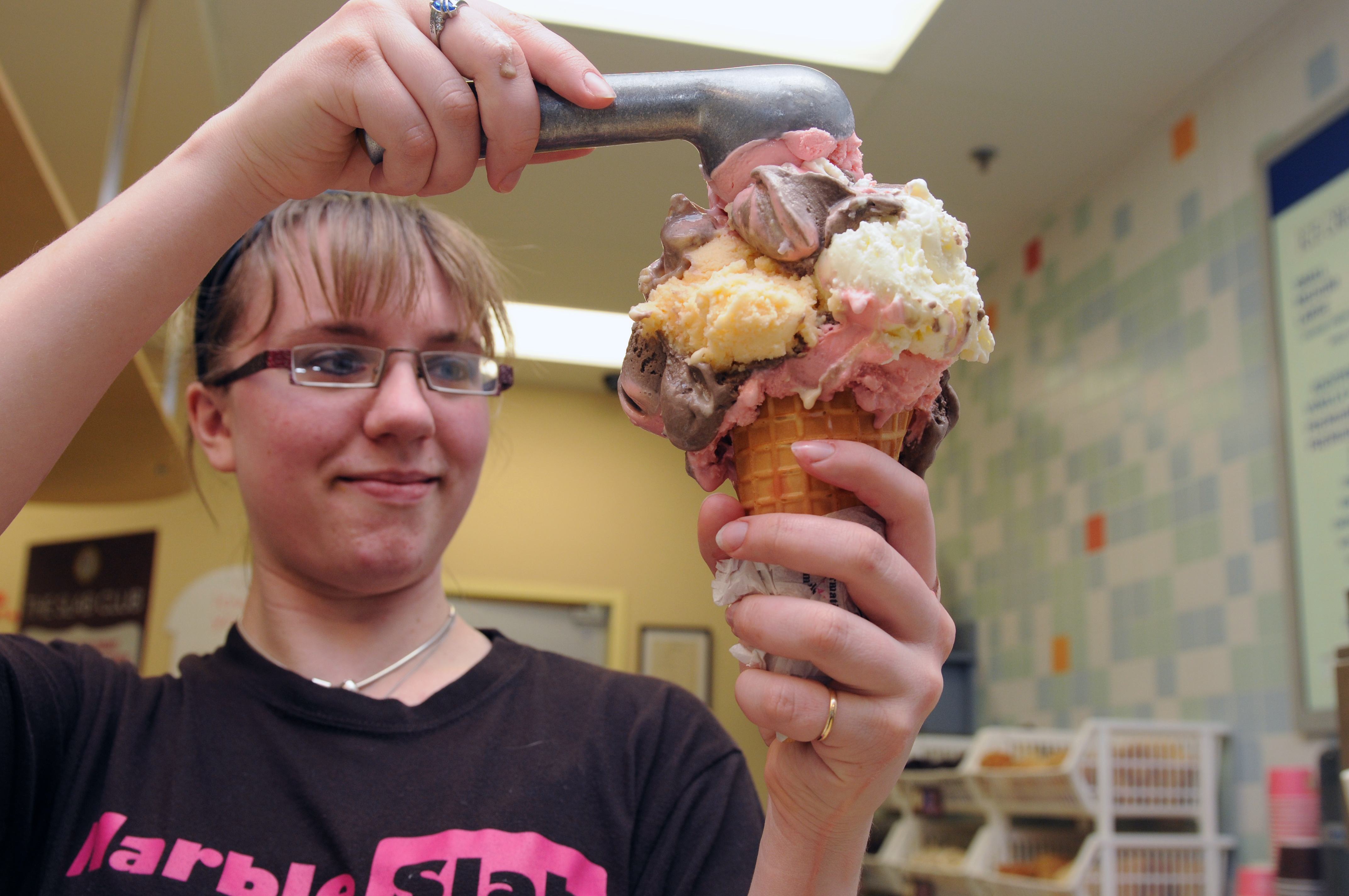 YUM- Dana Molyneaux scoops up some ice creme at the Marble Slab recently as summer is on its way.