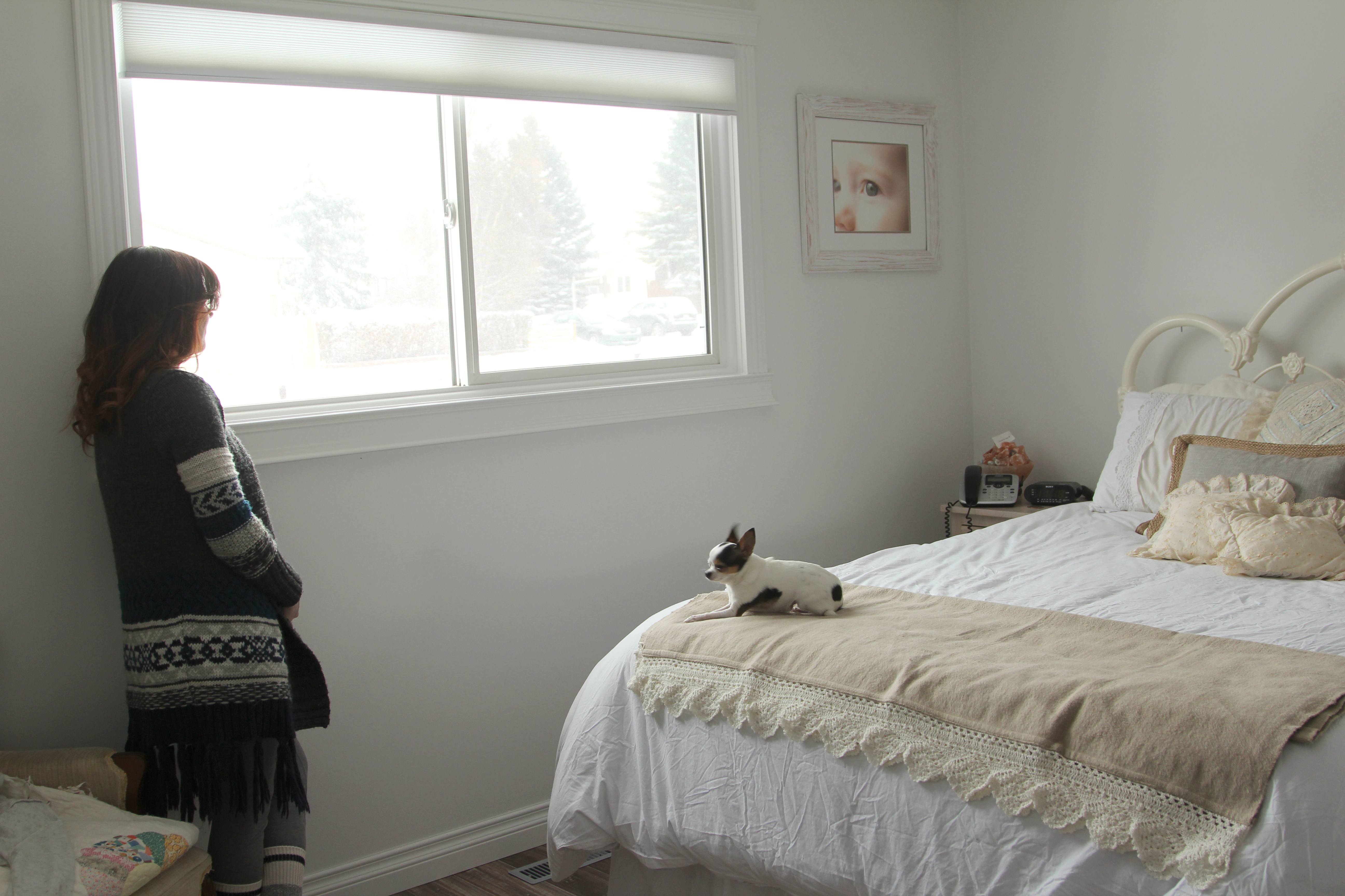 TERRIFYING - Jayme Ford stands near a window in her home as she reflects on the home invasion that took place in the early morning while her and her family were asleep last week.