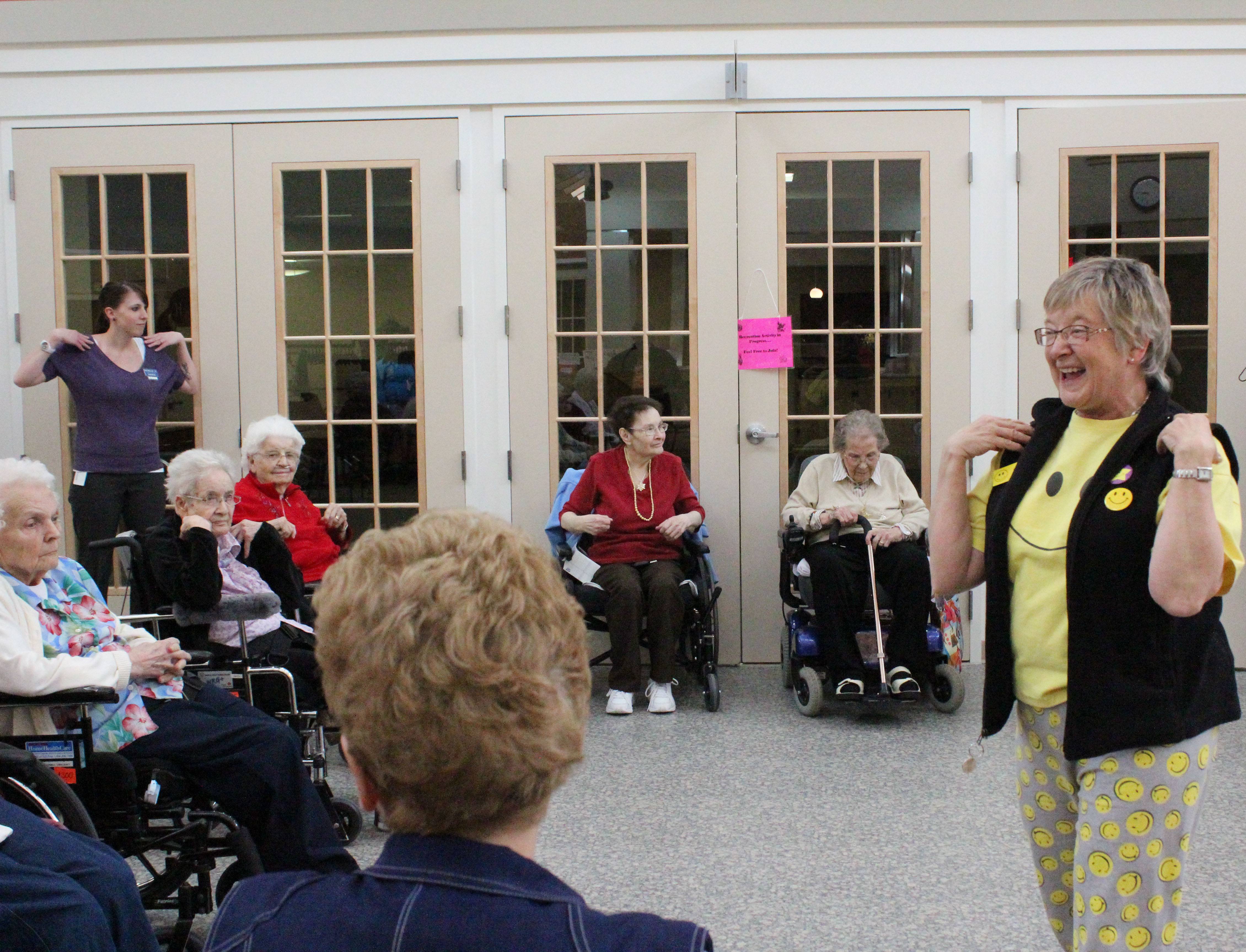 STRESS MANAGEMENT- Pat Parkinson of the Red Deer Laughter Club engages volunteers and residents of Extendicare Michener Hill in Laughter Yoga.