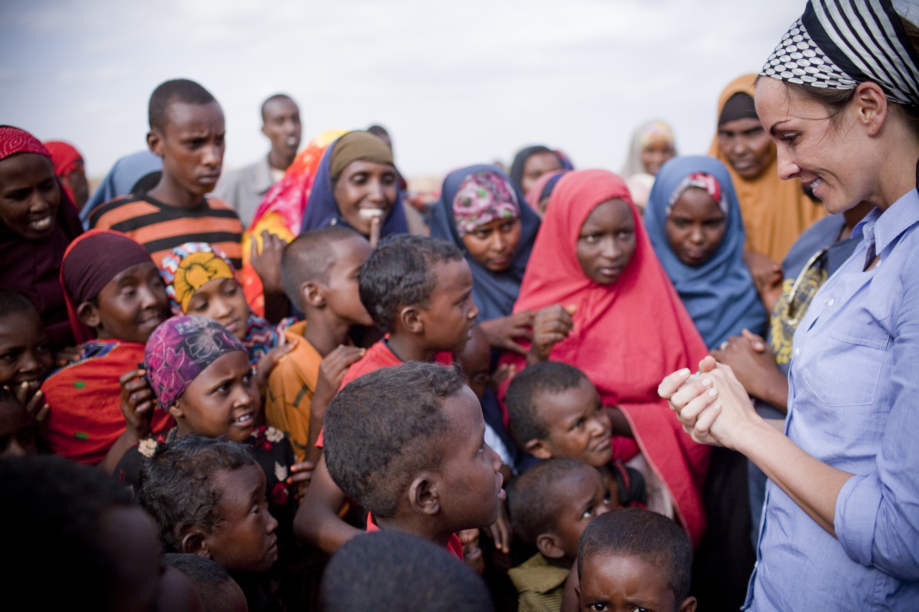 REACHING OUT- Amanda Lindhout talks with children during a recent trip to Africa. She continues her work to raise support for those in danger of starvation.
