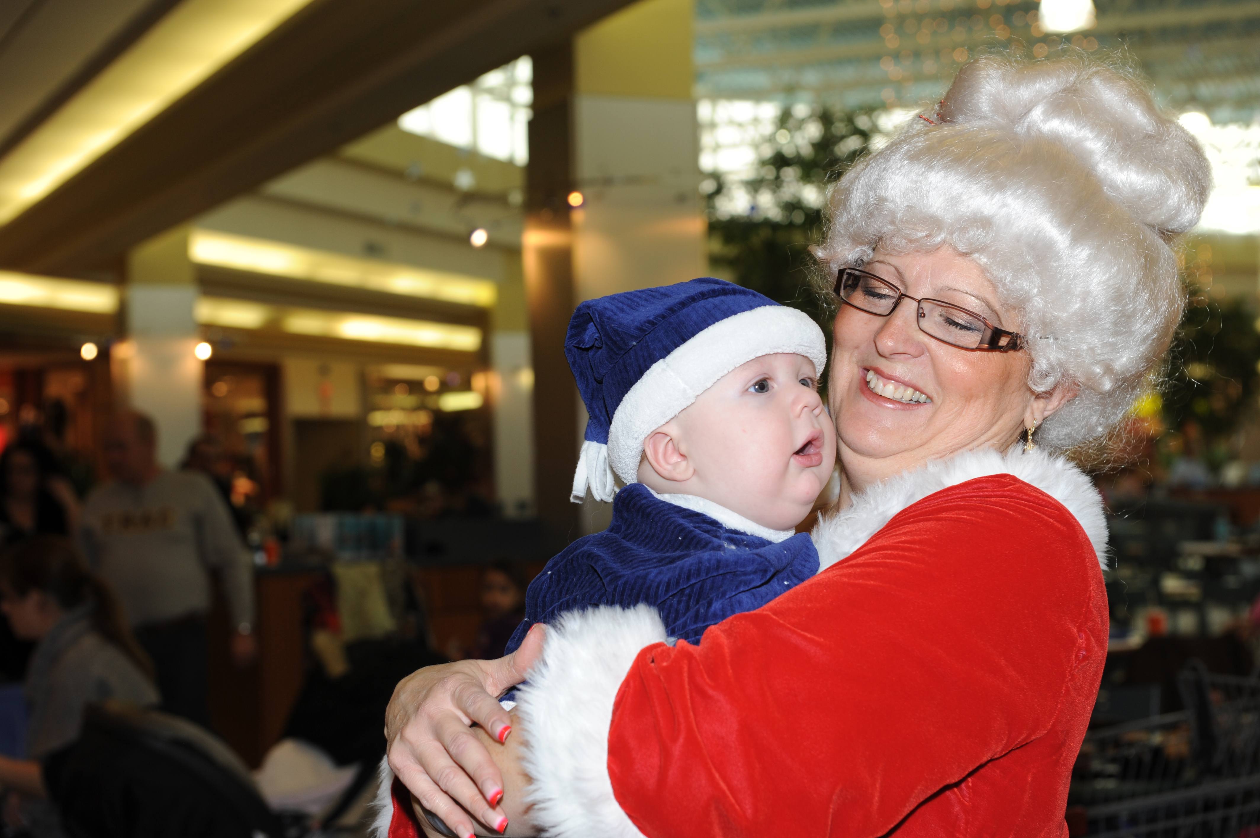 LITTLE ONE- Mrs. Claus holds Josiah Oickle