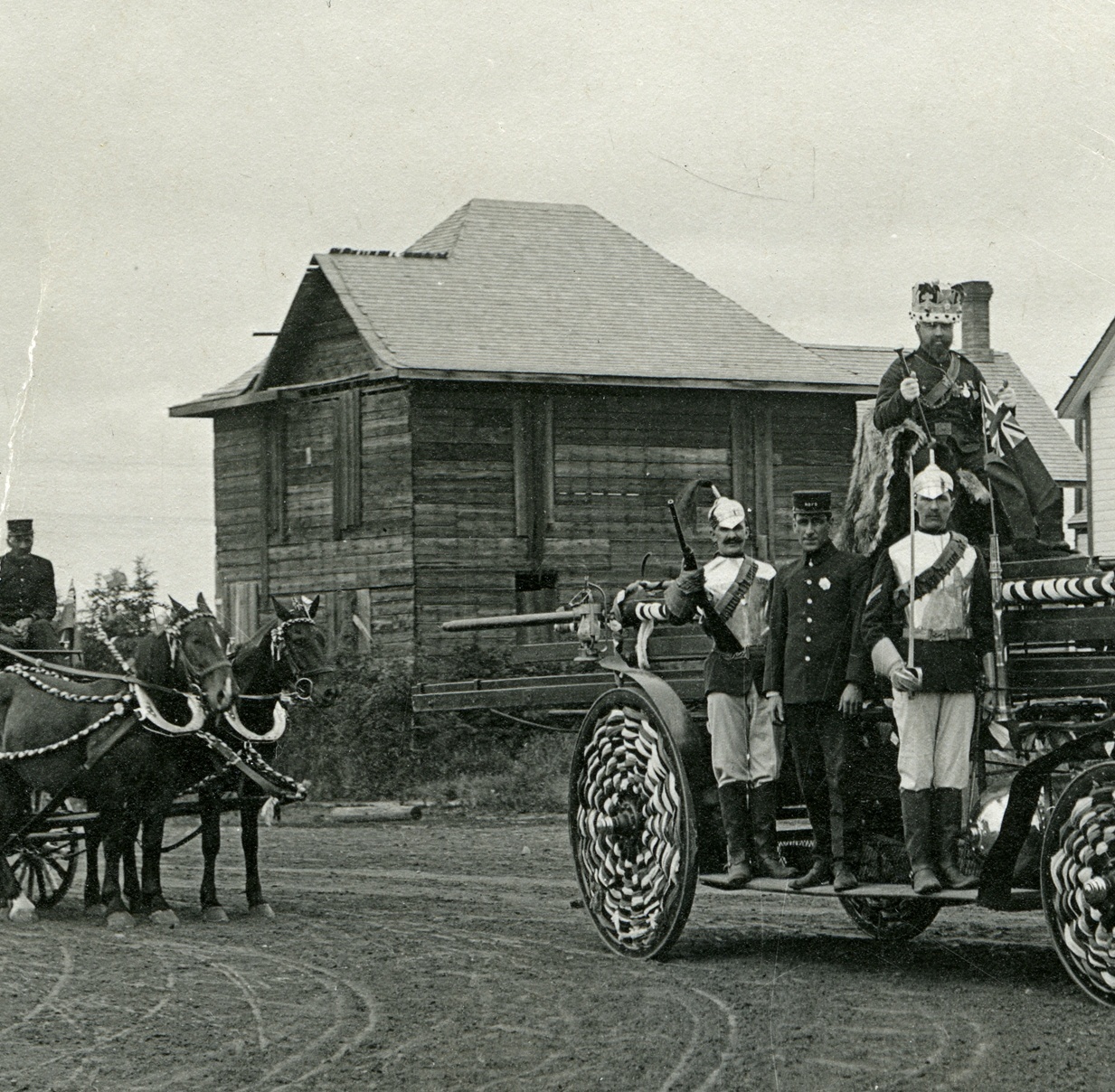 SPOOKY SIGHT - The boarded up Elder house on the northeast corner of Ross Street and 49th Ave. Photo taken during the Coronation Day parade along Ross Street in June 1911.