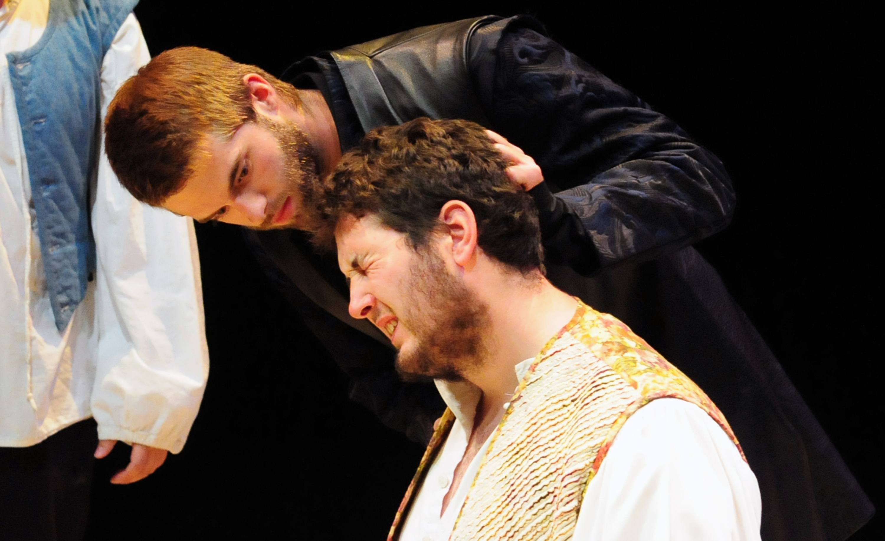 DRAMATIC- Actors Derick Neumeier holds Tucker New’s hair during an intense scene from Red Deer College Theatre Studies’ Fuente Ovejuna. The play runs through Saturday at in Red Deer College’s Studio A.