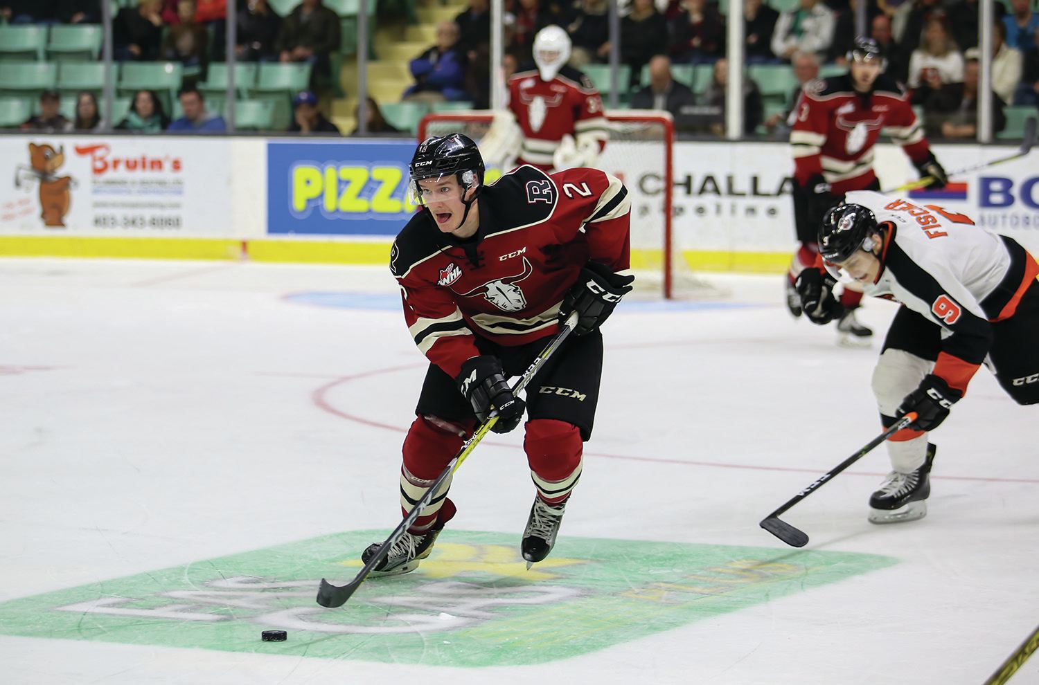 SHUTDOWN - Austin Strand of the Red Deer Rebels carried the puck up the ice during a matchup against the Medicine Hat Tigers earlier this week. Strand has become one of the team’s top defensive defensemen this season.