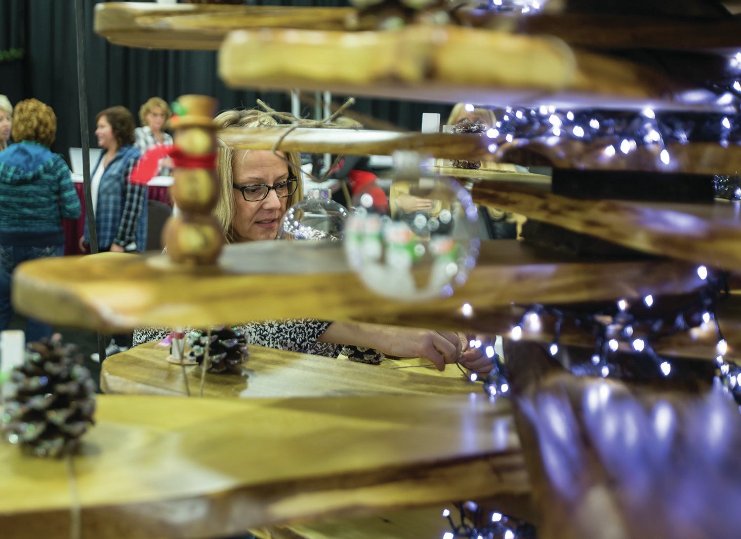 WORKING HARD - Sheila Sayers worked to put together a snowman themed Christmas tree display ahead of the annual Red Deer Festival of Trees at Westerner Park. The fundraiser will be raising money for the Medical Specialty Clinic at Red Deer Regional Hospital this year.