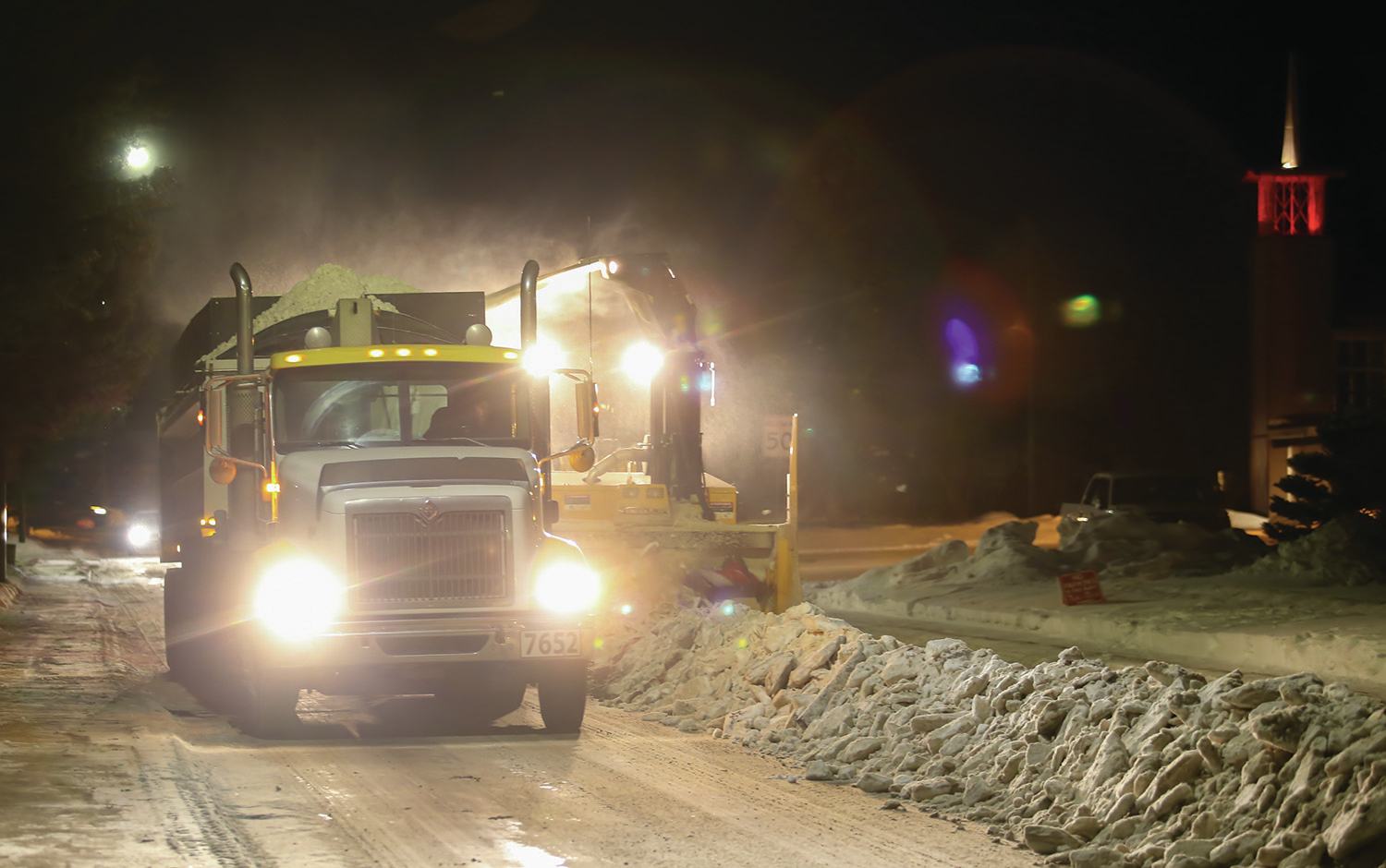 WORKING LATE - Crews worked to clear the snow from a street in Morrisroe last weekend. The City is currently working on clearing all streets in neighbourhoods in Red Deer.