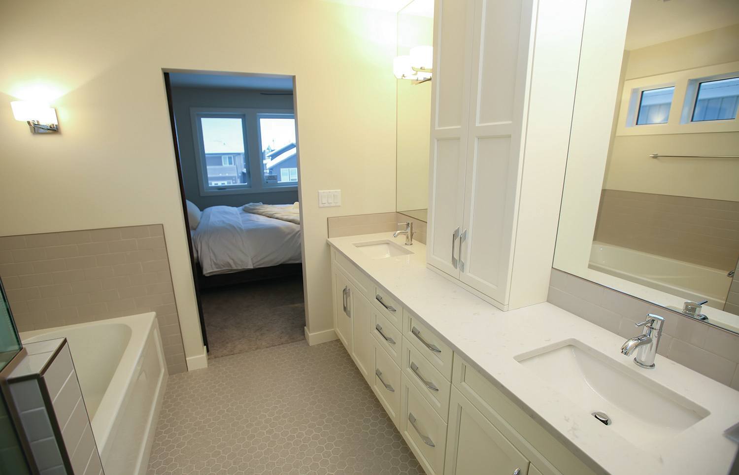 SIMPLE ELEGANCE - This large master bathroom in a Parkland Builders Group Limited show home in Laredo shows that simple colours with the right accents can make a space come alive.