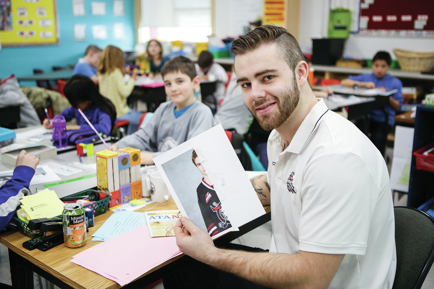 PARTNERSHIP - Red Deer Rebels forward Evan Polei held up his drawing of teammate Brandon Hagel during a special visit to classrooms at Annie L. Gaetz Elementary School.