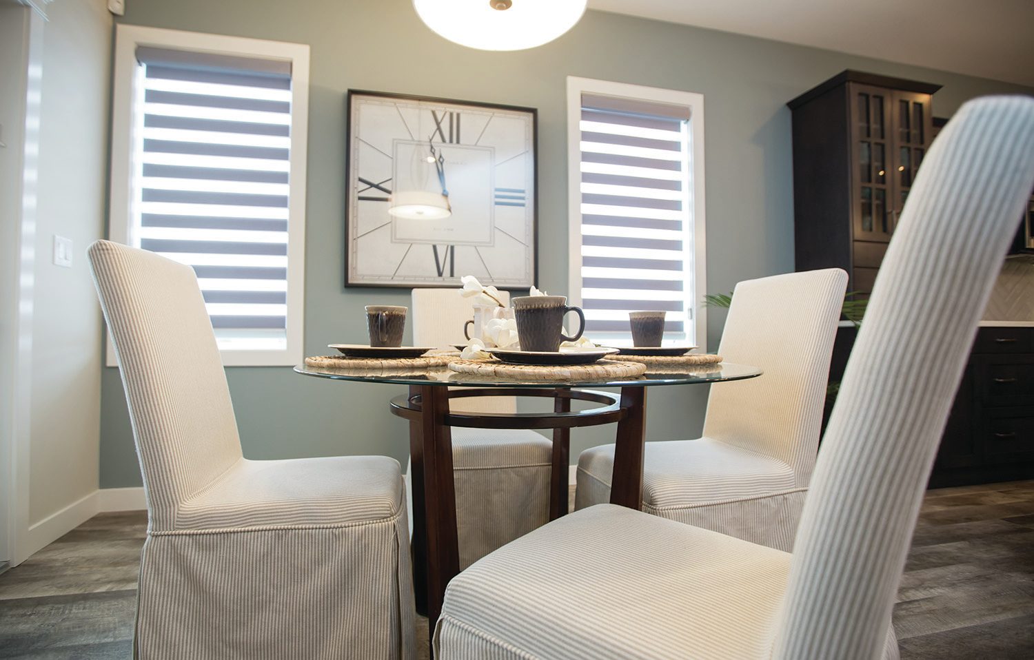 BE OUR GUEST - This dining area in a True-Line Homes show home in Laredo shows that you don’t need a huge dining table to make a space feel elegant and inviting.