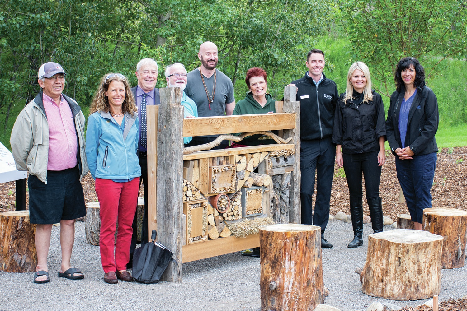 POLLINATOR FRIENDLY - City council members and project leaders join together for a picture with the newly installed ‘pollinator hotel’ that sits in the centre of the new garden at Bower Ponds. Bower Ponds has now become the fourth of the pollinator parks that can be found all around Red Deer.