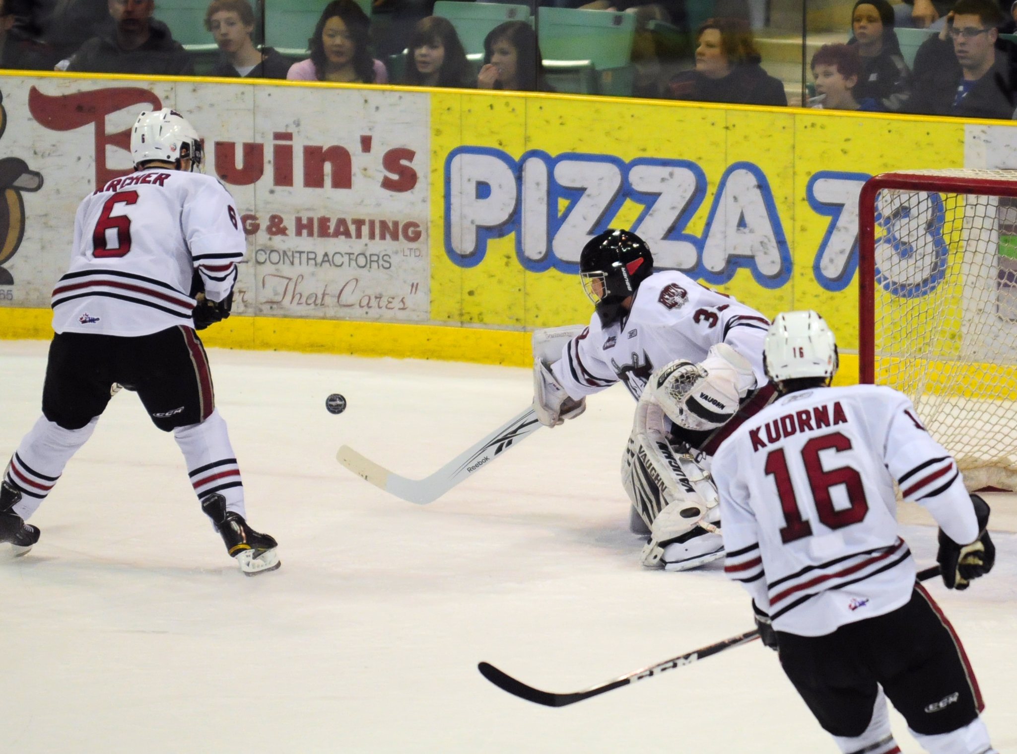 PUCK STOPPING- Red Deer Rebel Darcy Kuemper tries to stop the puck during WHL action Friday night against the Edmonton Oil Kings. The Rebels won 5-3 on Friday and again on Saturday with a 5-1 win.