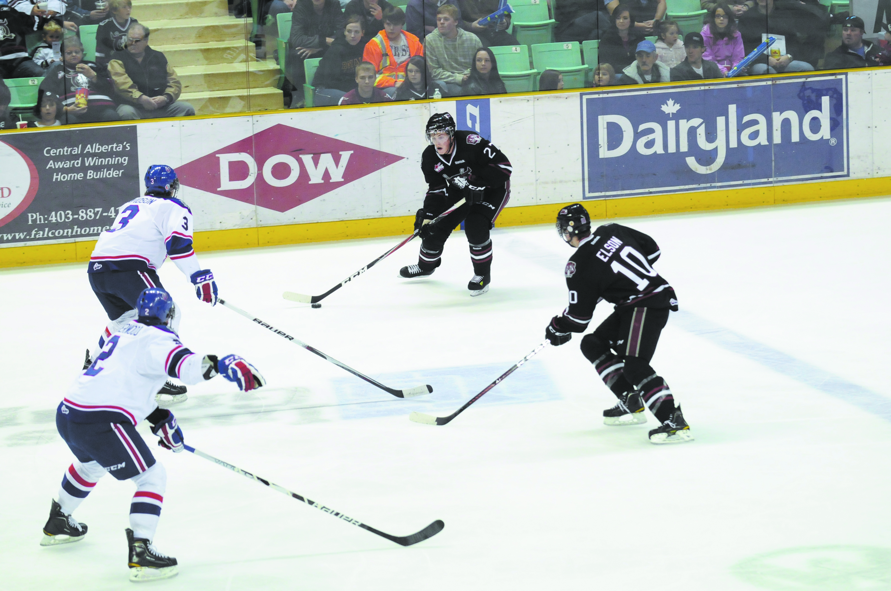 QUICK DECISIONS- Red Deer Rebels Locke Muller and Turner Elson (right side) made their way to the net during WHL action this past Saturday against the Regina Pats. The Rebels won 4-1.