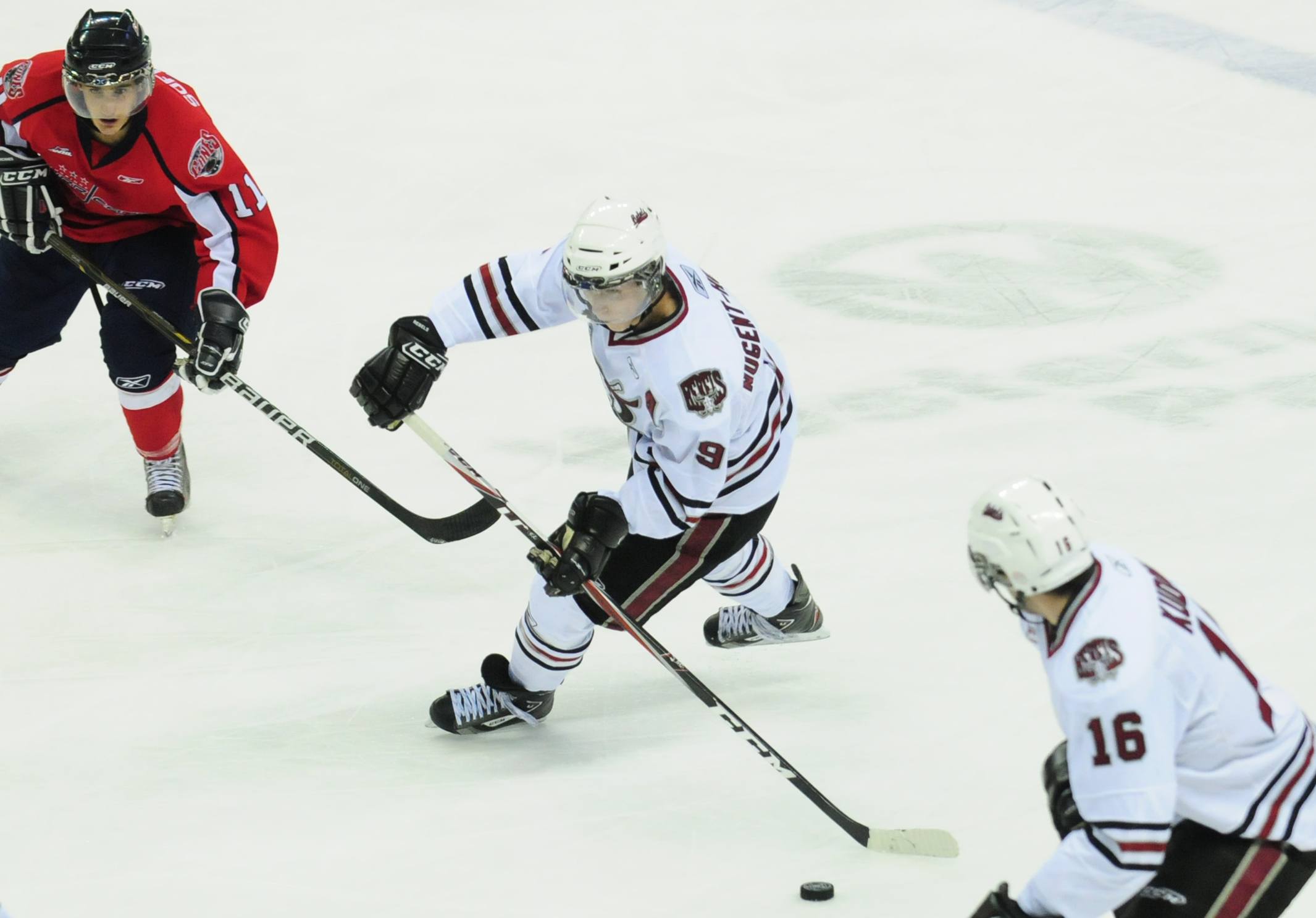 TEAMWORK- Red Deer Rebel Ryan Nugent-Hopkins speeds across the ice sneaking past Lethbridge Hurricane Michael Sofillas during WHL action Friday night. The Rebels won 2-1.