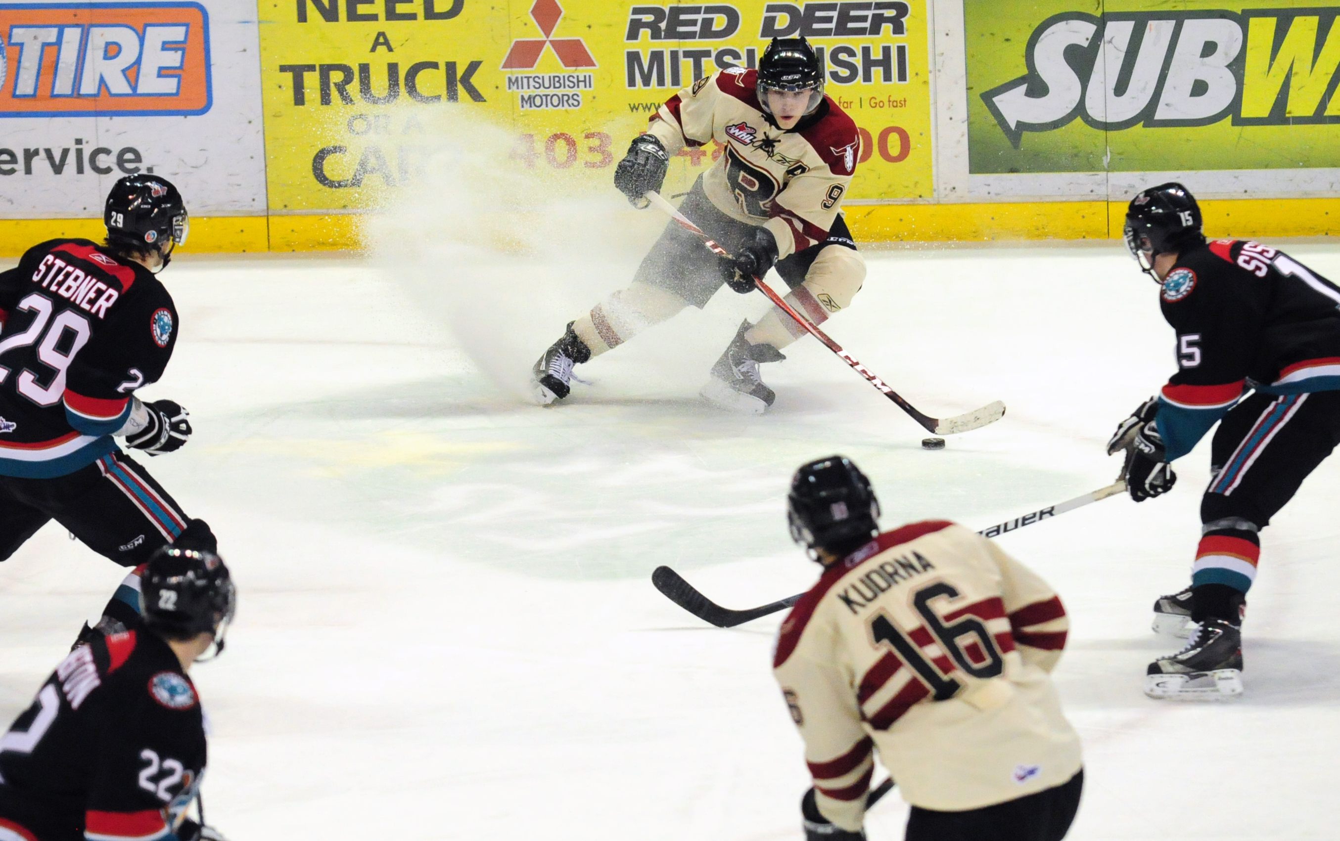 TOUGH BATTLE - Red Deer Rebels Ryan Nugent-Hopkins steers the puck away and looks to pass during WHL action Friday night against Kelowna. The Rebels lost 0-1.