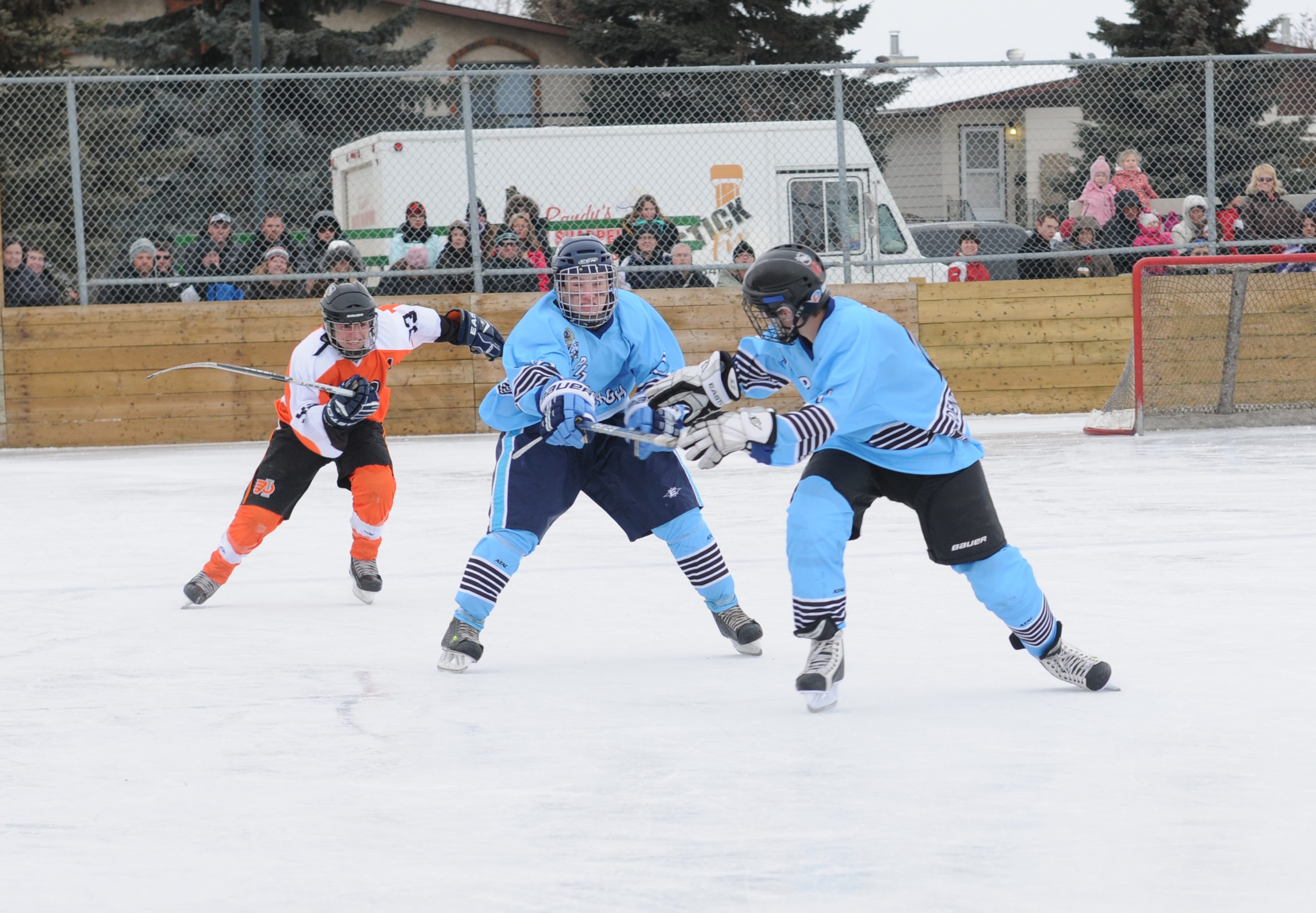 SPEEDY PASS- One of the events in the Red Deer Pond Hockey Skills Competition held this past weekend was a hockey stick relay where teams had to pass off the stick and make their way around the rink before the other team.