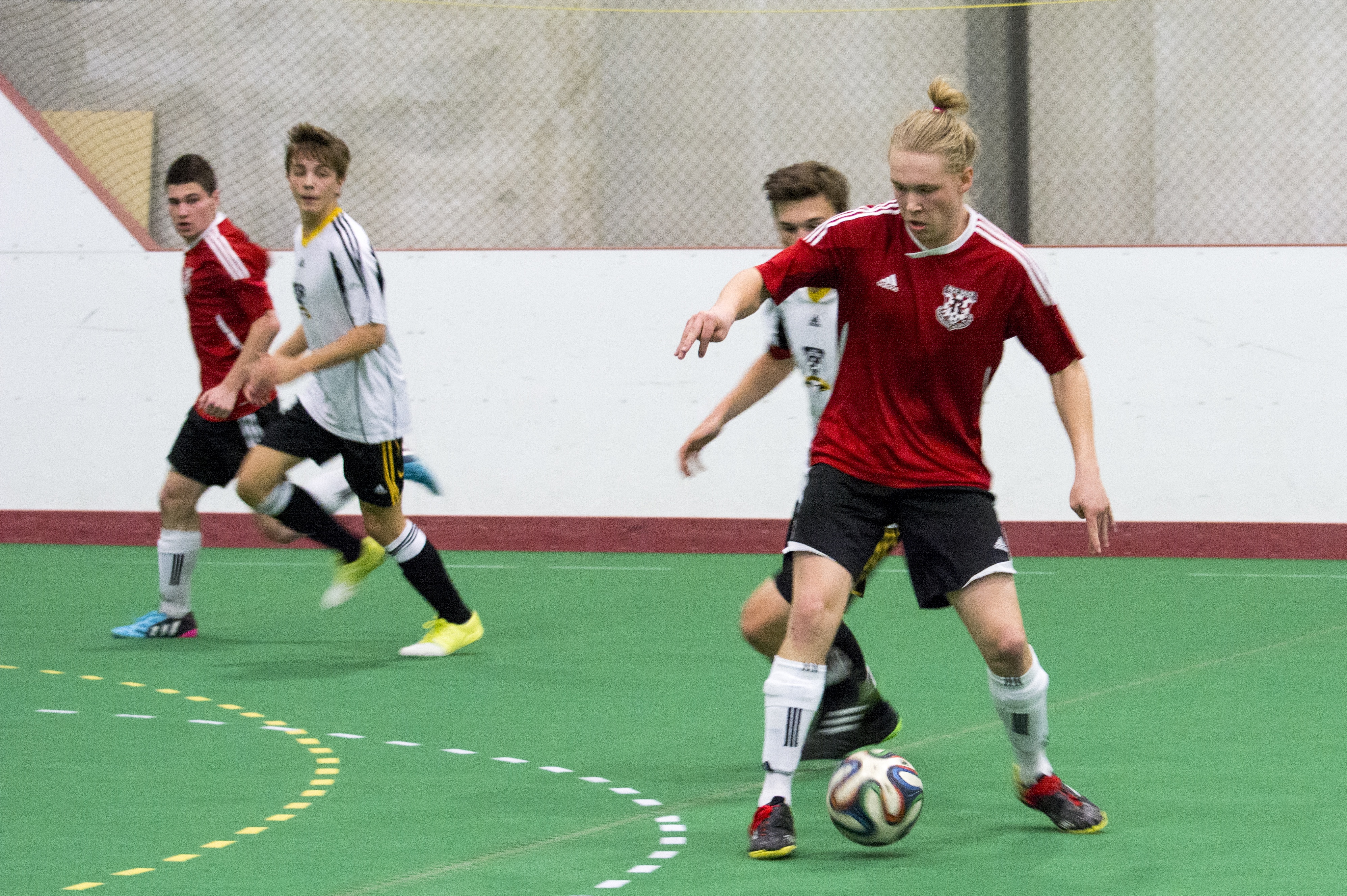 BIG WIN – The U-18 Tier II Renegades indoor soccer club won a provincial gold medal on their home field over the weekend at the Collicutt Centre. Renegade Simon Fuller works the ball towards the Medicine Hat Rattlers net in a match