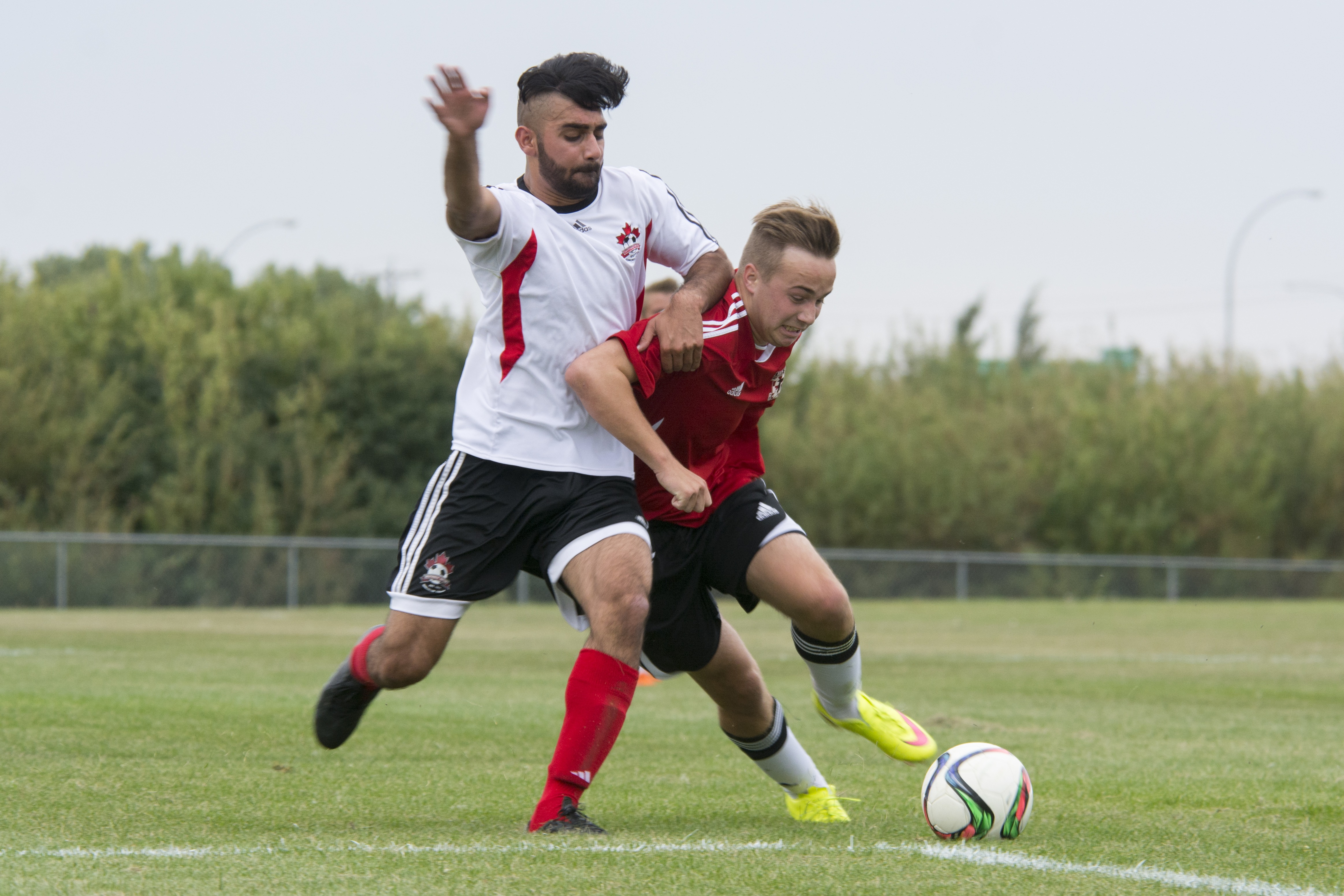 BIG WIN – U-18 Red Deer Renegade Ryan Vleeming fights for the ball against Edmonton SW United player