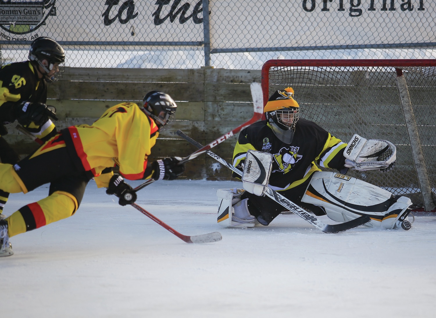 SWEET SAVE - Goaltender Gord Bennett of the Spruce Grove Penguins stopped a shot by Zac Powell of the Red Deer Canucks during the Tommy Gun’s Winter Classic at the Bower Community Rinks on Saturday. The annual outdoor tournament wrapped up its sixth successful year last weekend.
