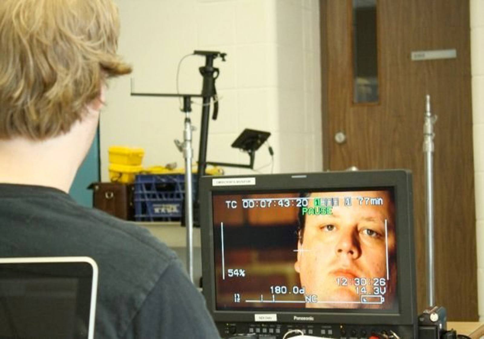 ON SET-Director Matthew Orobko watching lead actor and producer Jeff Woodward on a monitor during filming of Tumaini in 2009 in Red Deer.