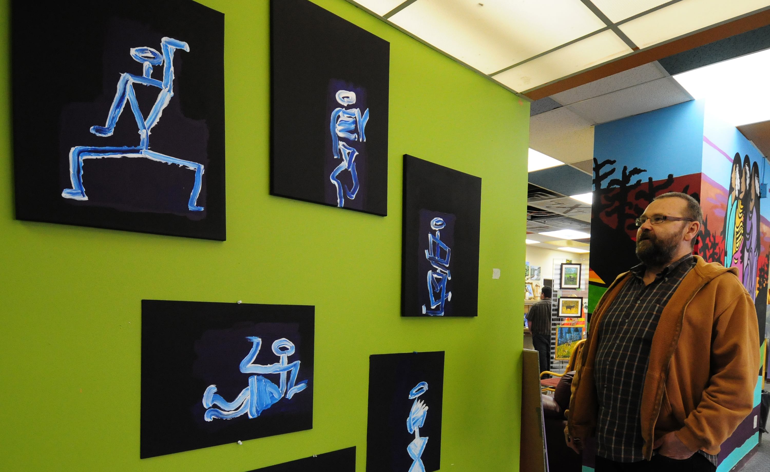 ARTSY- Local artist Robert Fleming stands beside his collection of paintings titled 'Angel Bones' during Art from the Streets Friday afternoon in their studio at 4935 51 Street.