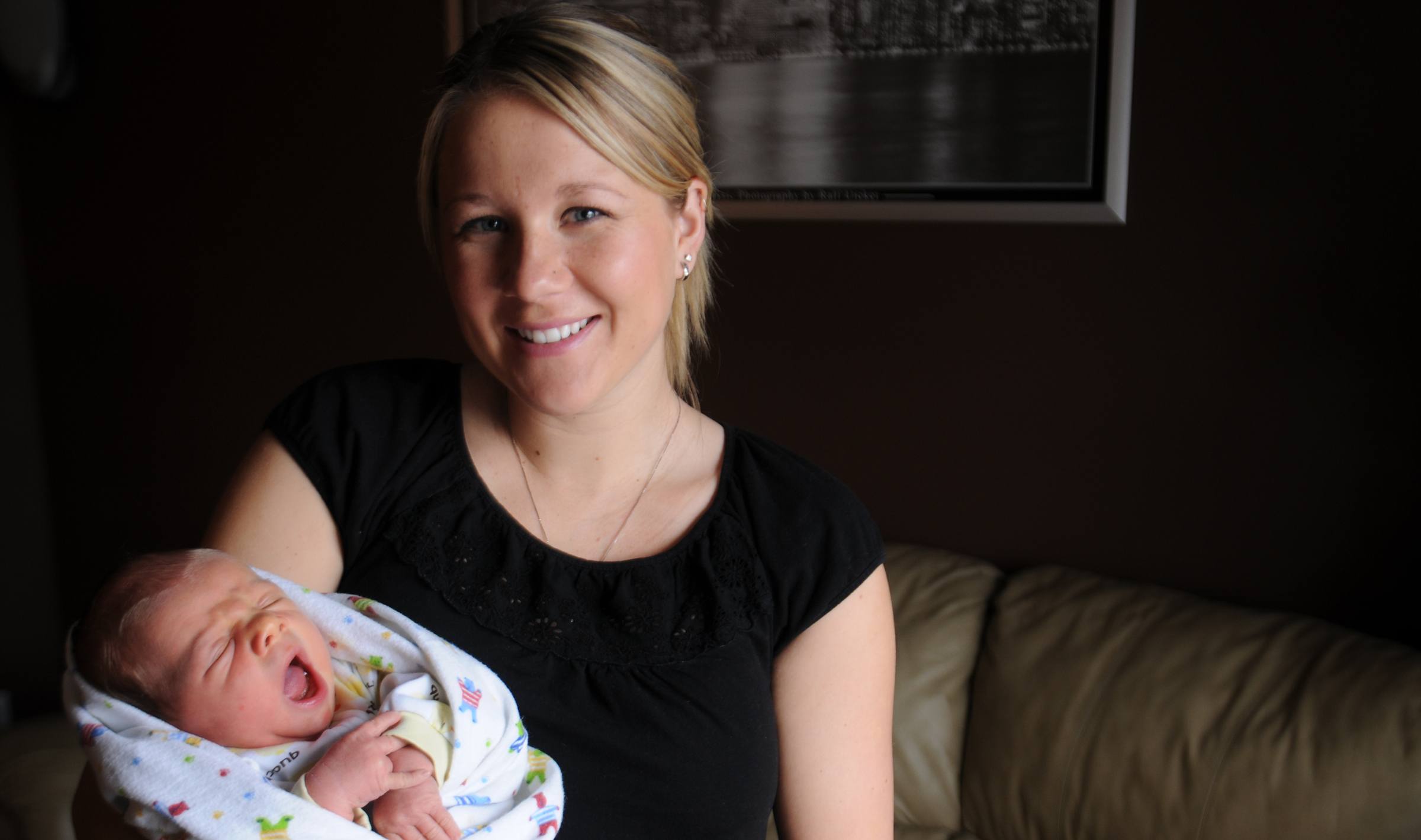 BIG YAWN- Jamie Gray holds her newborn Chase J.J.