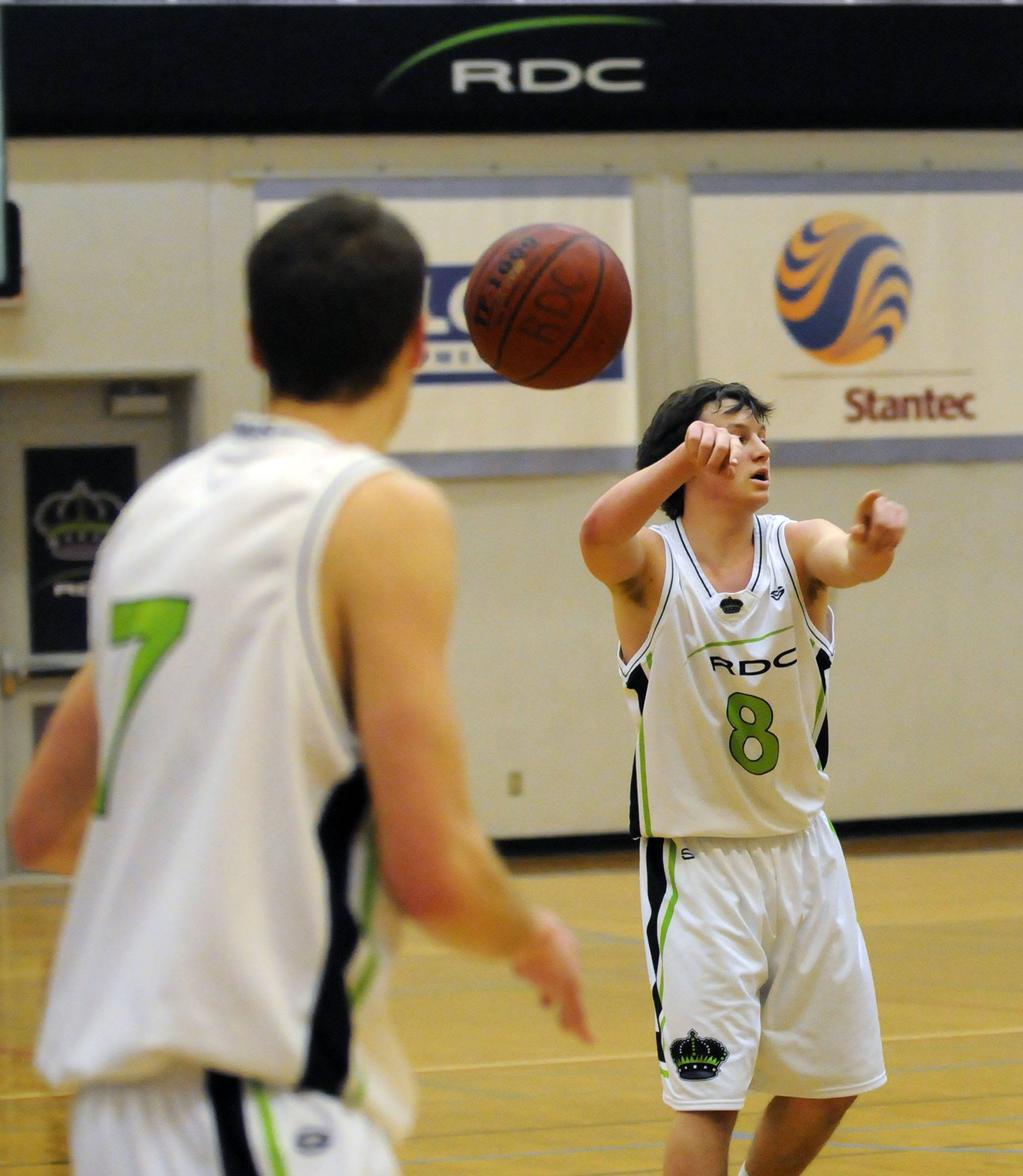 SNEAKY PASS- Red Deer College King Lloyd Strickland makes a quick pass to Adam Shaw during Friday night’s game against the Mount Royal Cougars. The Kings lost 81-58.