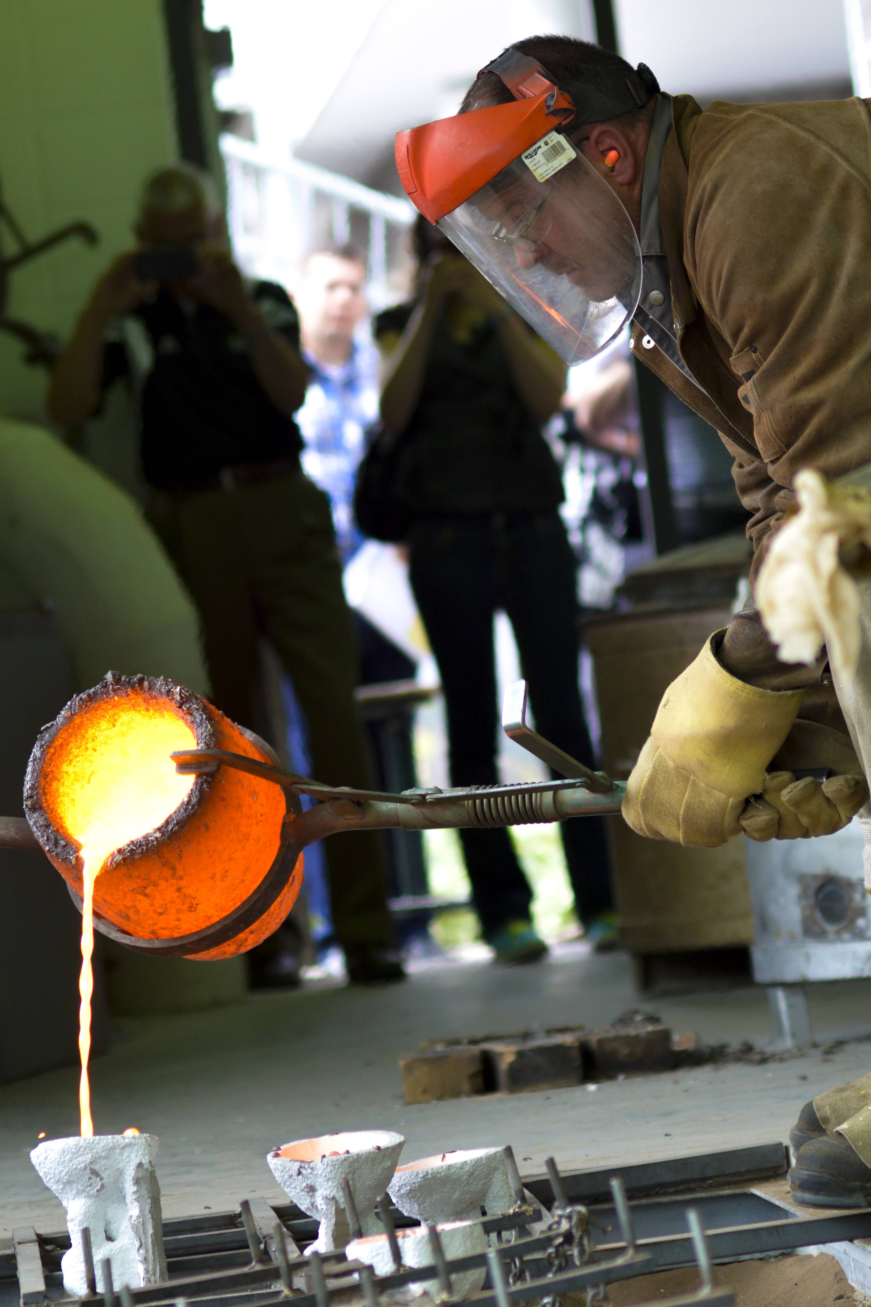 BEAUTIFUL BRONZE – Trevor Danbrook pours molten bronze into a ceramic mold during a demonstration of Red Deer College’s bronze working facilities and foundries on Monday.