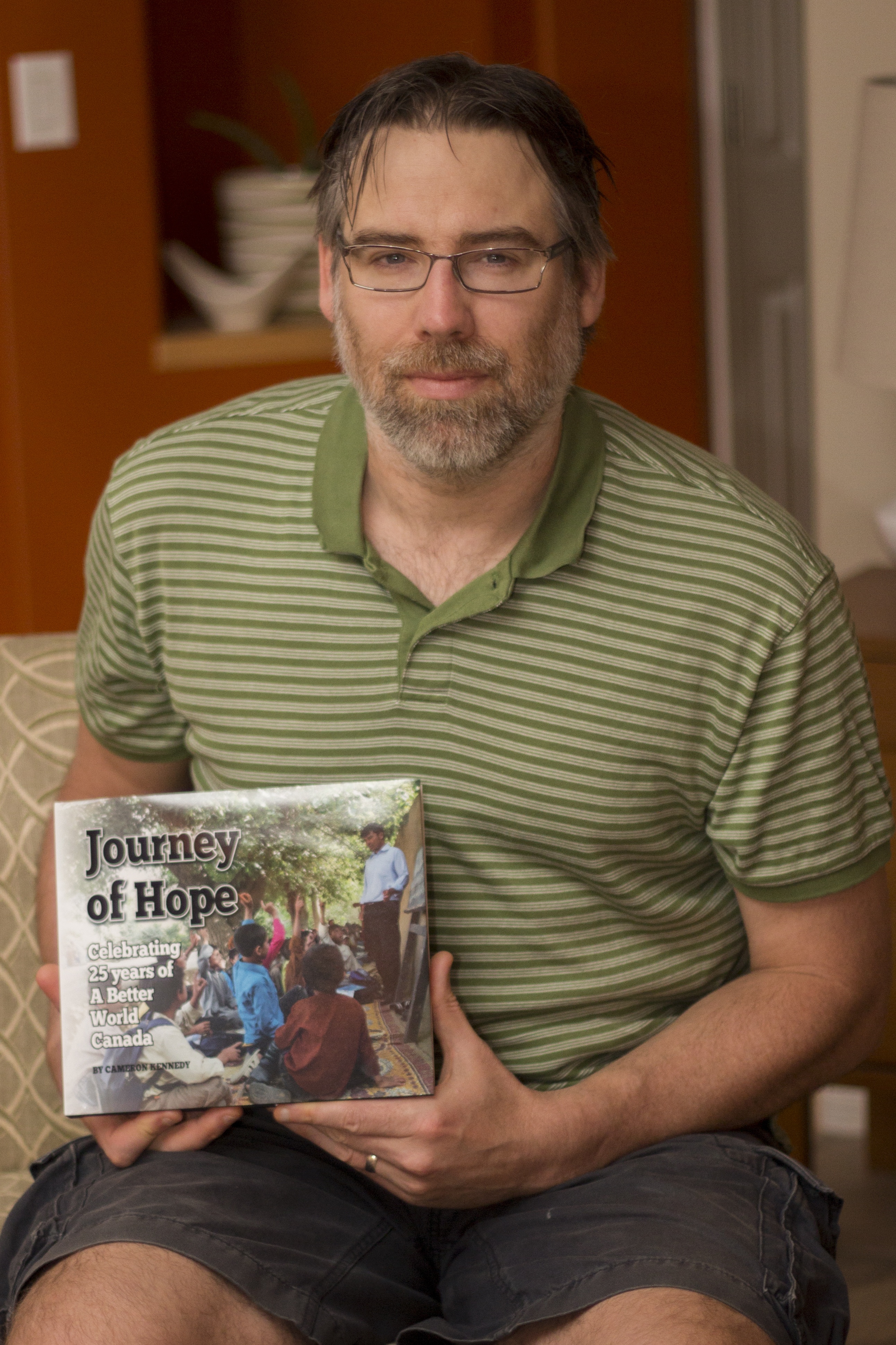 ACCOMPLISHMENT – Author and journalist Cameron Kennedy with his book Journey of Hope