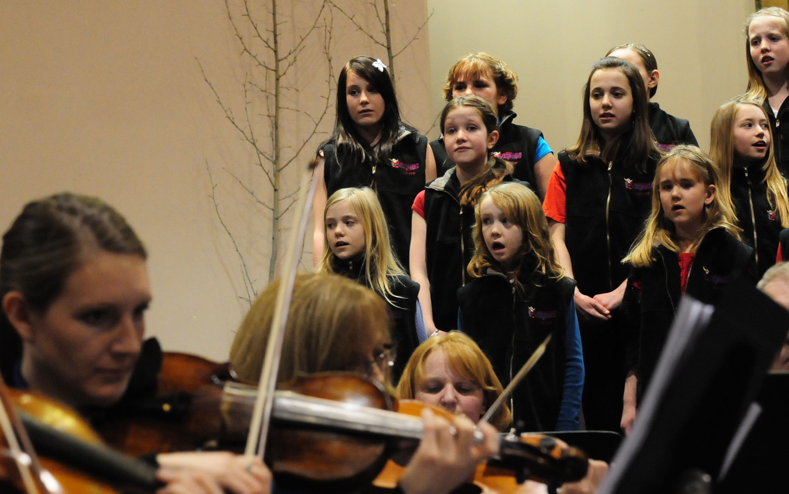 SINGING PROUD- Students from different school choir's came out to the New Life Fellowship Church Monday night to sing along with the Red Deer Symphony Orchestra.