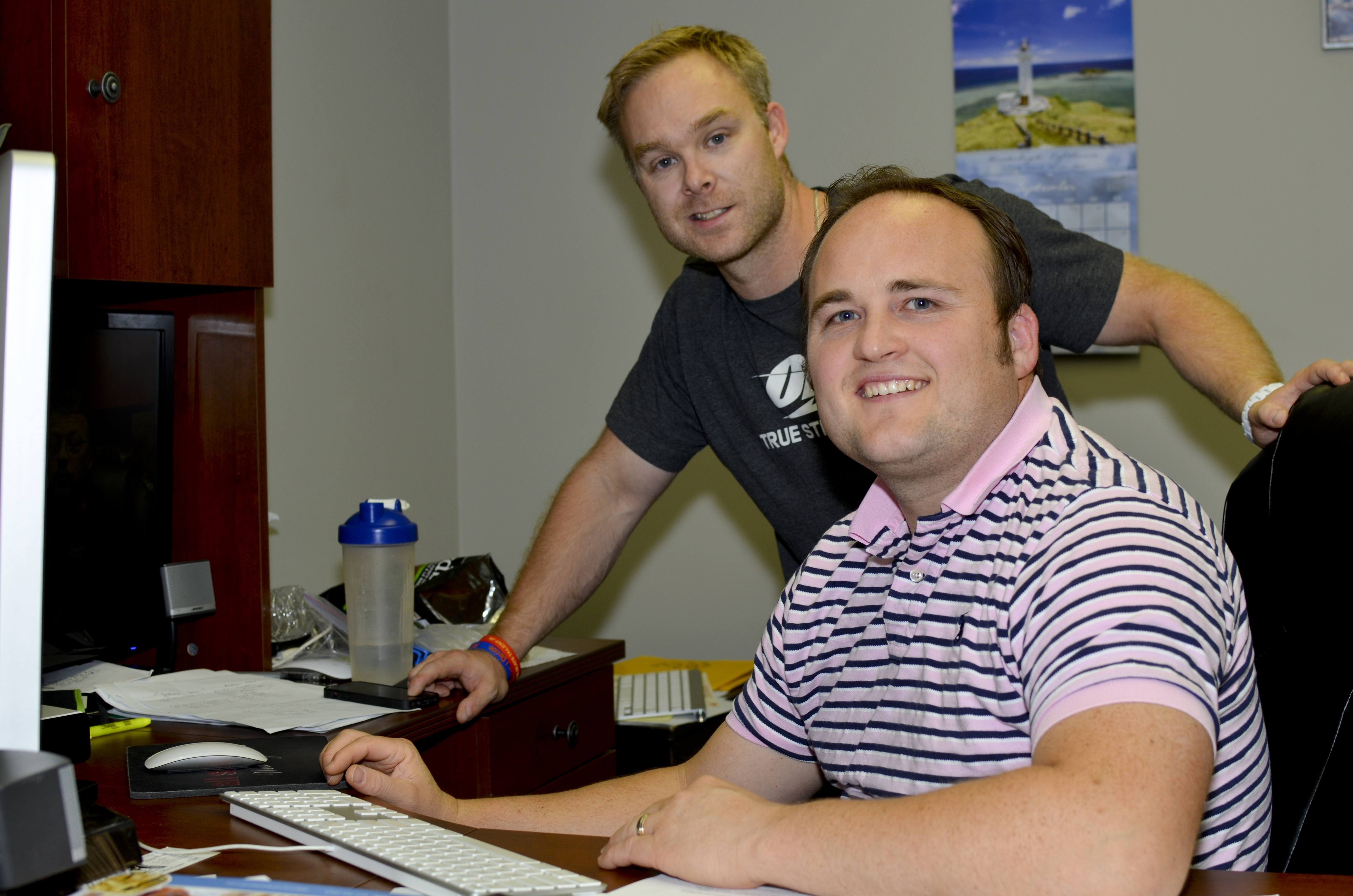 FINAL TOUCHES – Drew Kenworthy (seated) and Cabel McElderry work on their inspiring new documentary entitled Change. The film will be screened Thursday evening at the Galaxy Cinema.