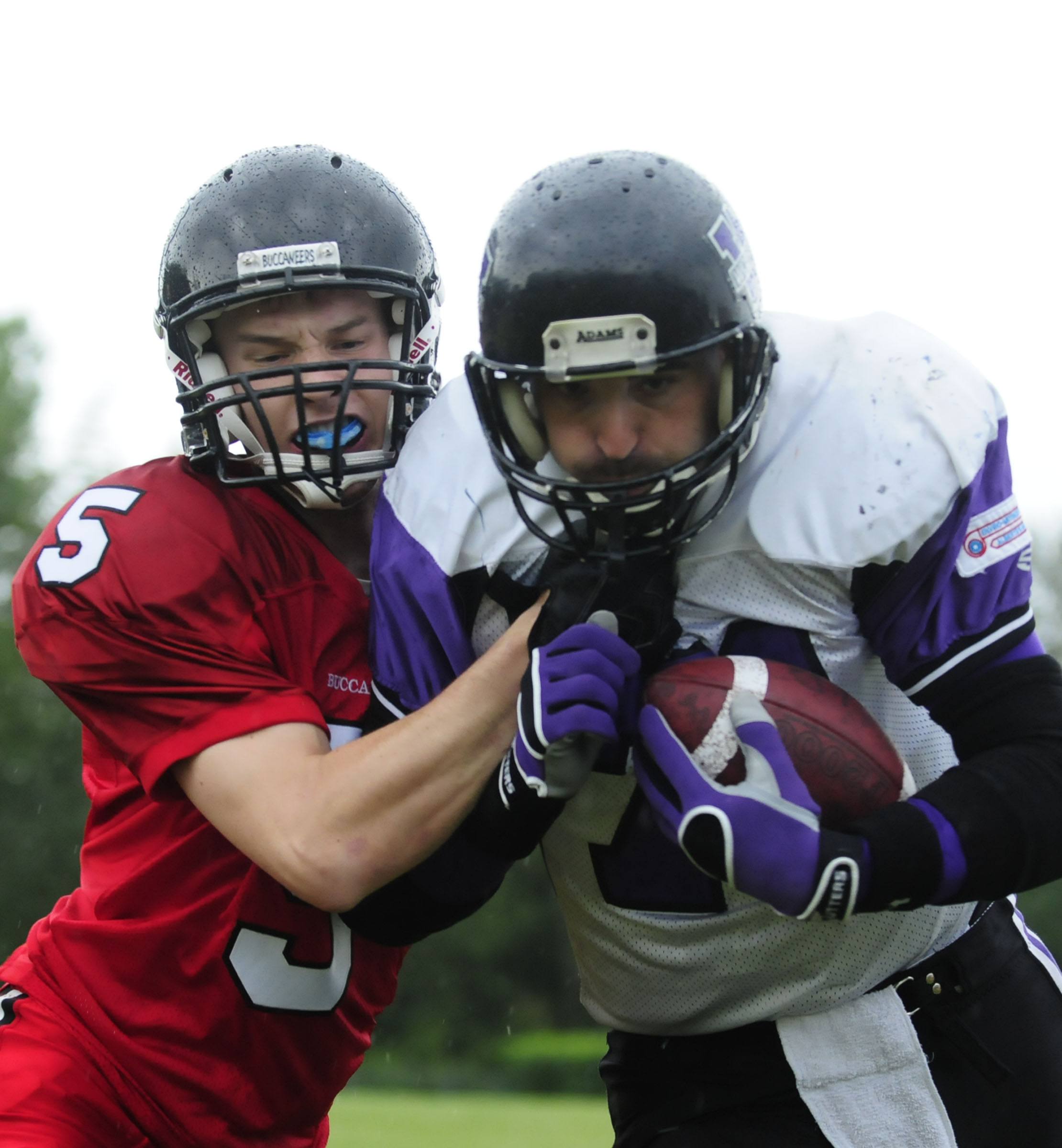 ed Deer's Tylor Johnson takes down Calgary Wolfpack Mike Leason during AFL action Saturday evening.