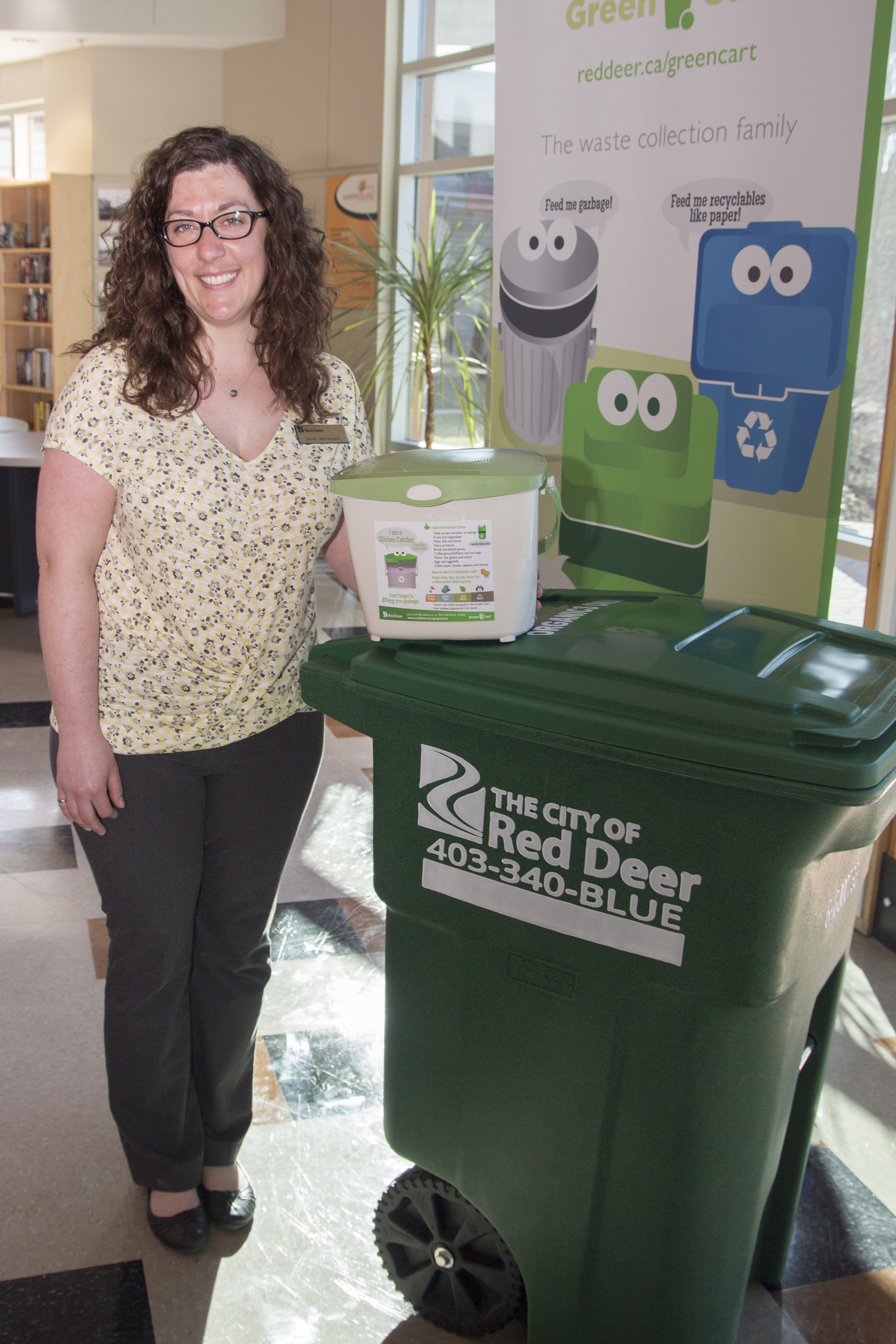 NEW PROGRAM – Waste Management Superintendent for the City of Red Deer Janet Whitesell stands beside the new green cart and kitchen bin that are tools in a plan to help reduce the amount of organic waste in the City landfill.