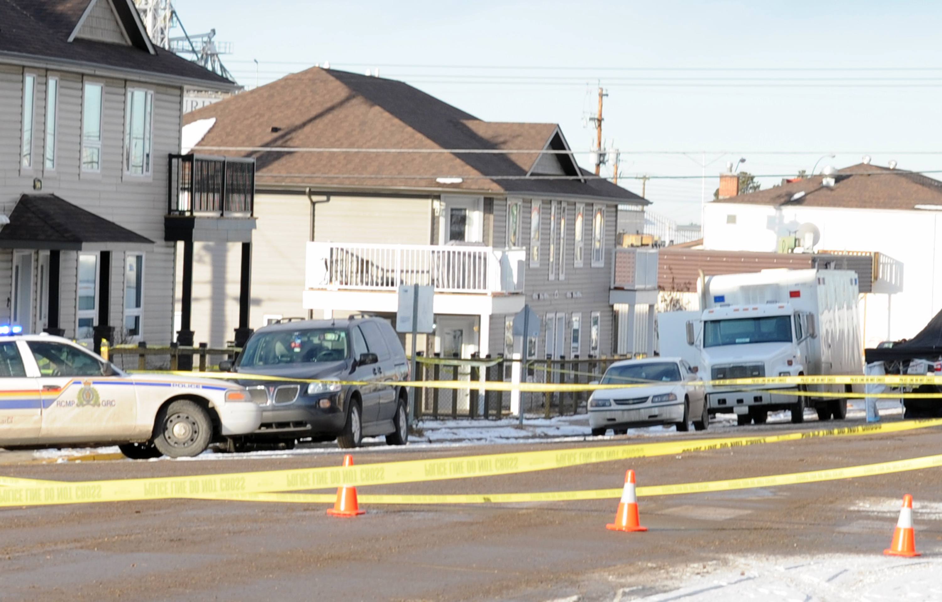 INVESTIGATION- RCMP members work to figure out the cause of an explosion in a small townhouse in Innisfail last week.