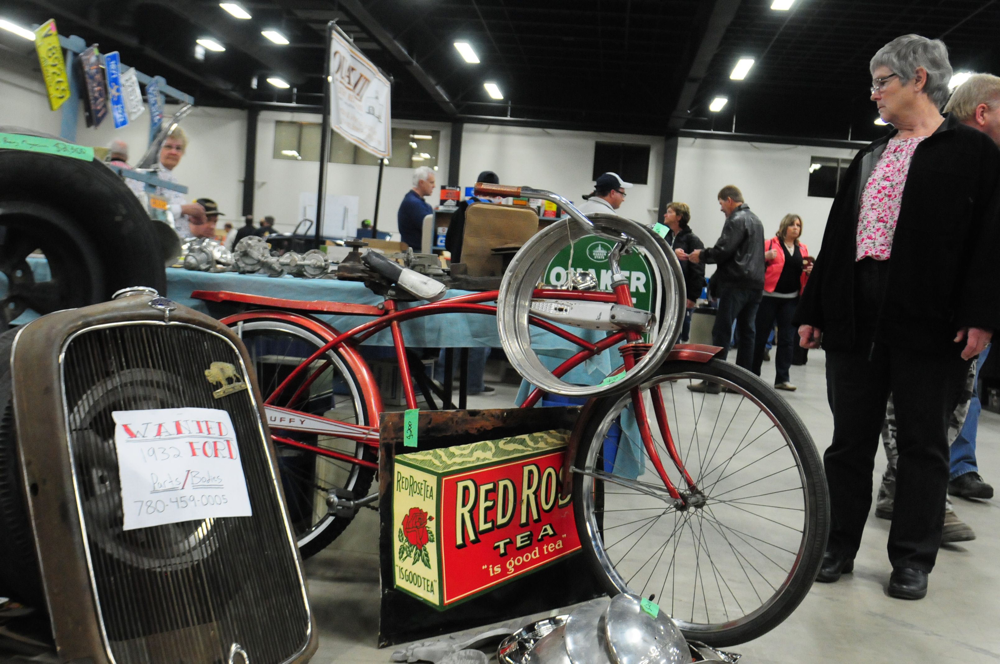 TREASURE- A woman looks through some vintage vehicle parts during the Vintage Car Show this past weekend at the Westerner.