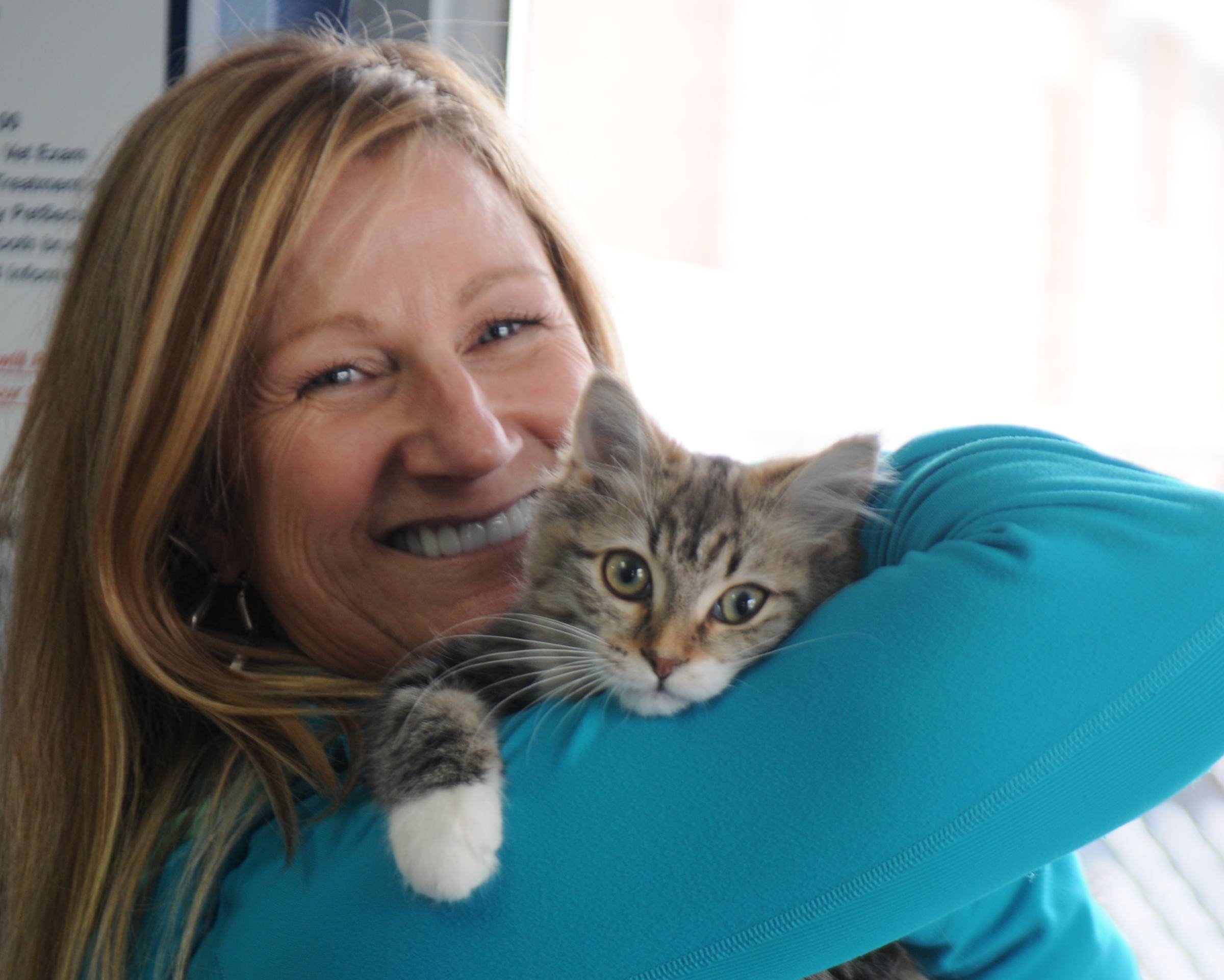 BONDING TIME-- Monica Zombori was the first one to adopt a cat this year from Alberta Animal Services in Red Deer. Her new kitten Paige waited 33 days at the shelter until Zombori came along. The shelter hopes to adopt out 100 in total for this year.