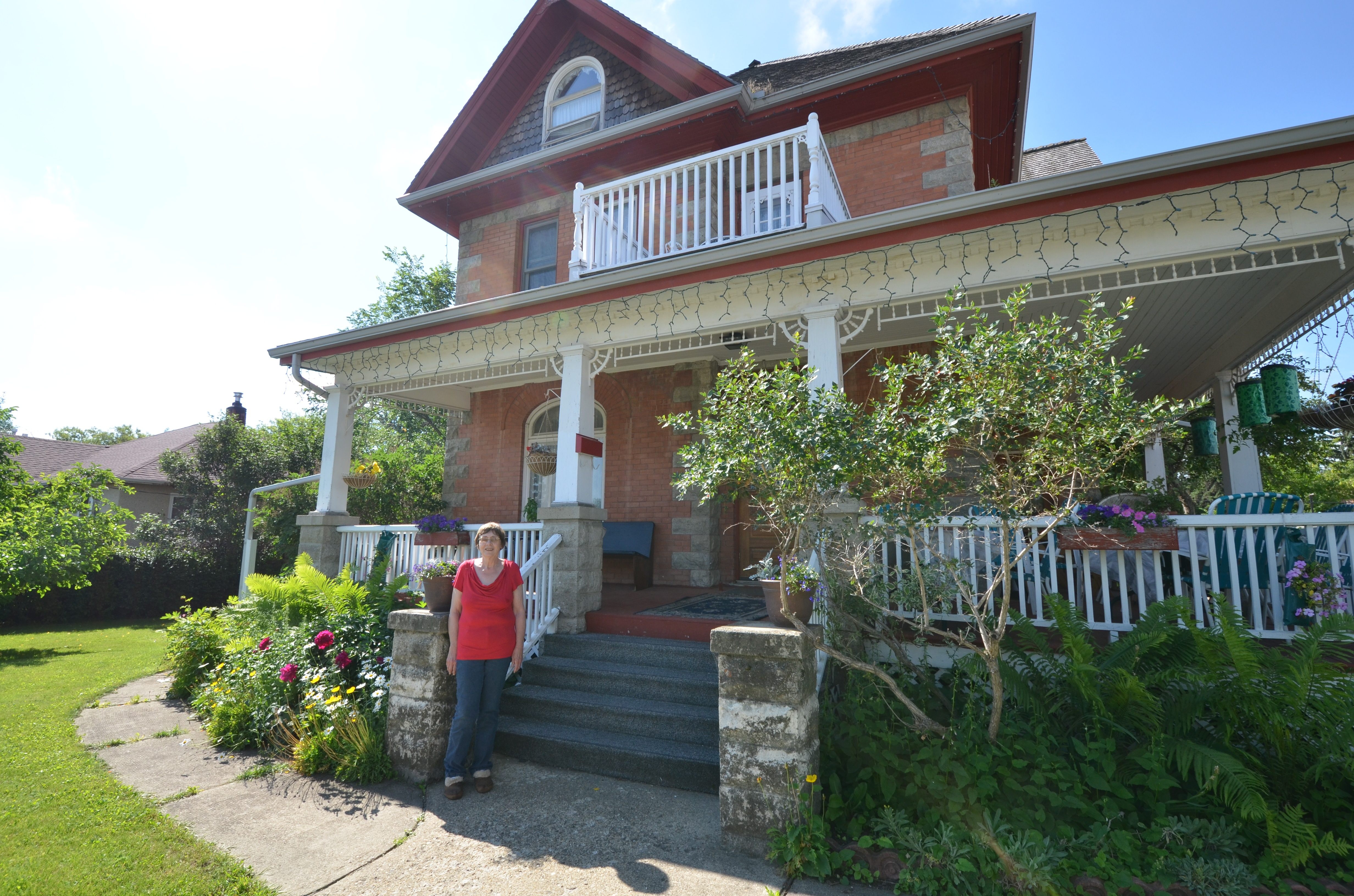 HISTORIC HOME - Owner Trudy Madole stands in front of one of the oldest houses in Red Deer that she now runs as a bed and breakfast.