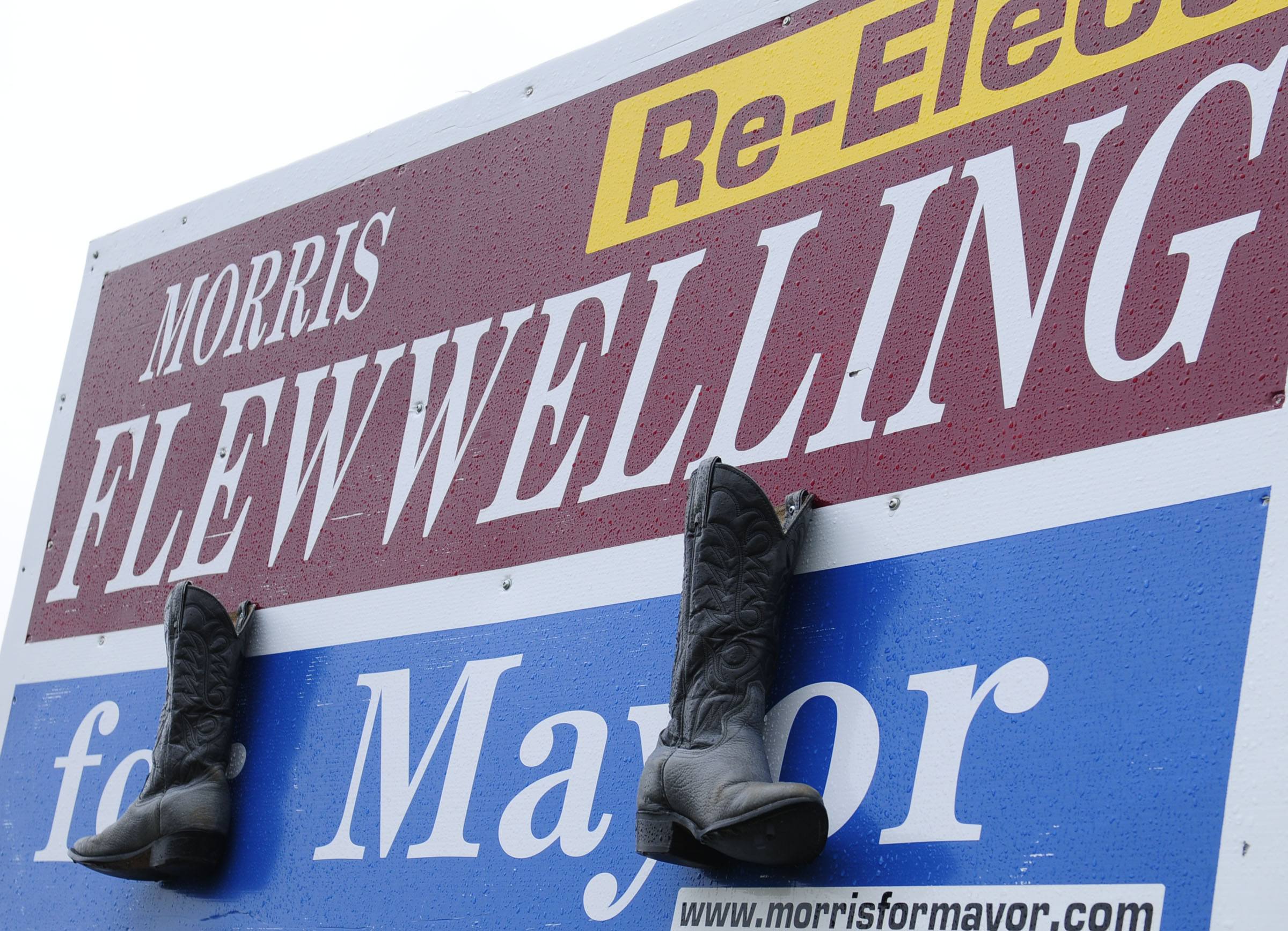 A pair of old cowboy boots were hung on a campaign sign of Morris Flewwelling on Taylor Drive in Red Deer recently as a practical joke during the upcoming election.